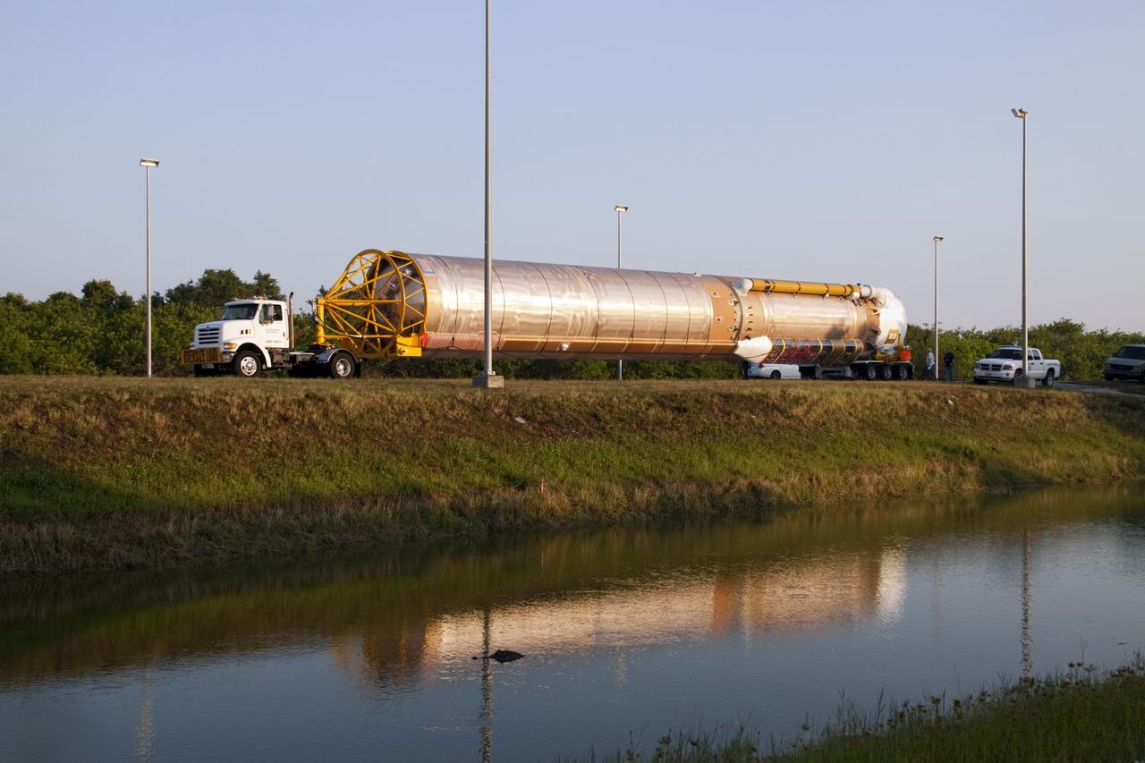 CAPE CANAVERAL, Fla. -- At Cape Canaveral Air Force Station in Florida, the first stage of a United Launch Alliance Atlas V rocket is being transported from its hangar at the Atlas Spaceflight Operations Center to Launch Complex 41.              NASA's Juno spacecraft is scheduled to launch aboard an Atlas V from Cape Canaveral, Fla. Aug. 5.The solar-powered spacecraft will orbit Jupiter's poles 33 times to find out more about the gas giant's origins, structure, atmosphere and magnetosphere and investigate the existence of a solid planetary core. For more information visit: www.nasa.gov/juno. Photo credit: NASA/Jack Pfaller