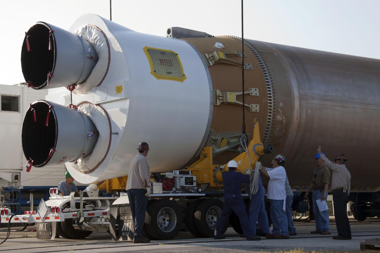 CAPE CANAVERAL, Fla. -- At Cape Canaveral Air Force Station in Florida, workers prepare the first stage of a United Launch Alliance Atlas V rocket to be lifted into the Vertical Integration Facility at Launch Complex 41. NASA's Juno spacecraft is scheduled to launch aboard an Atlas V from Cape Canaveral, Fla. Aug. 5.The solar-powered spacecraft will orbit Jupiter's poles 33 times to find out more about the gas giant's origins, structure, atmosphere and magnetosphere and investigate the existence of a solid planetary core. For more information visit: www.nasa.gov/juno. Photo credit: NASA/Jack Pfaller