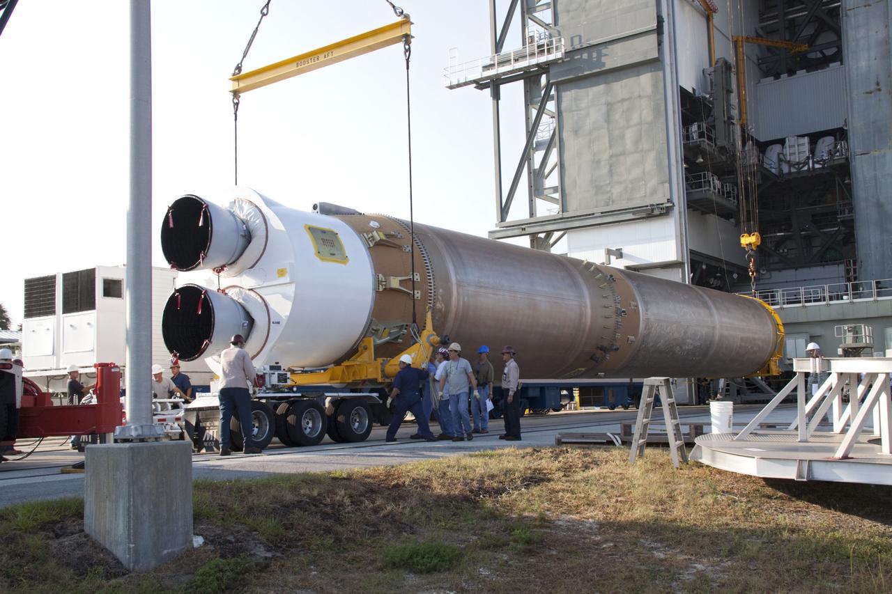 CAPE CANAVERAL, Fla. -- At Cape Canaveral Air Force Station in Florida, workers prepare the first stage of a United Launch Alliance Atlas V rocket to be lifted into the Vertical Integration Facility at Launch Complex 41. NASA's Juno spacecraft is scheduled to launch aboard an Atlas V from Cape Canaveral, Fla. Aug. 5.The solar-powered spacecraft will orbit Jupiter's poles 33 times to find out more about the gas giant's origins, structure, atmosphere and magnetosphere and investigate the existence of a solid planetary core. For more information visit: www.nasa.gov/juno. Photo credit: NASA/Jack Pfaller