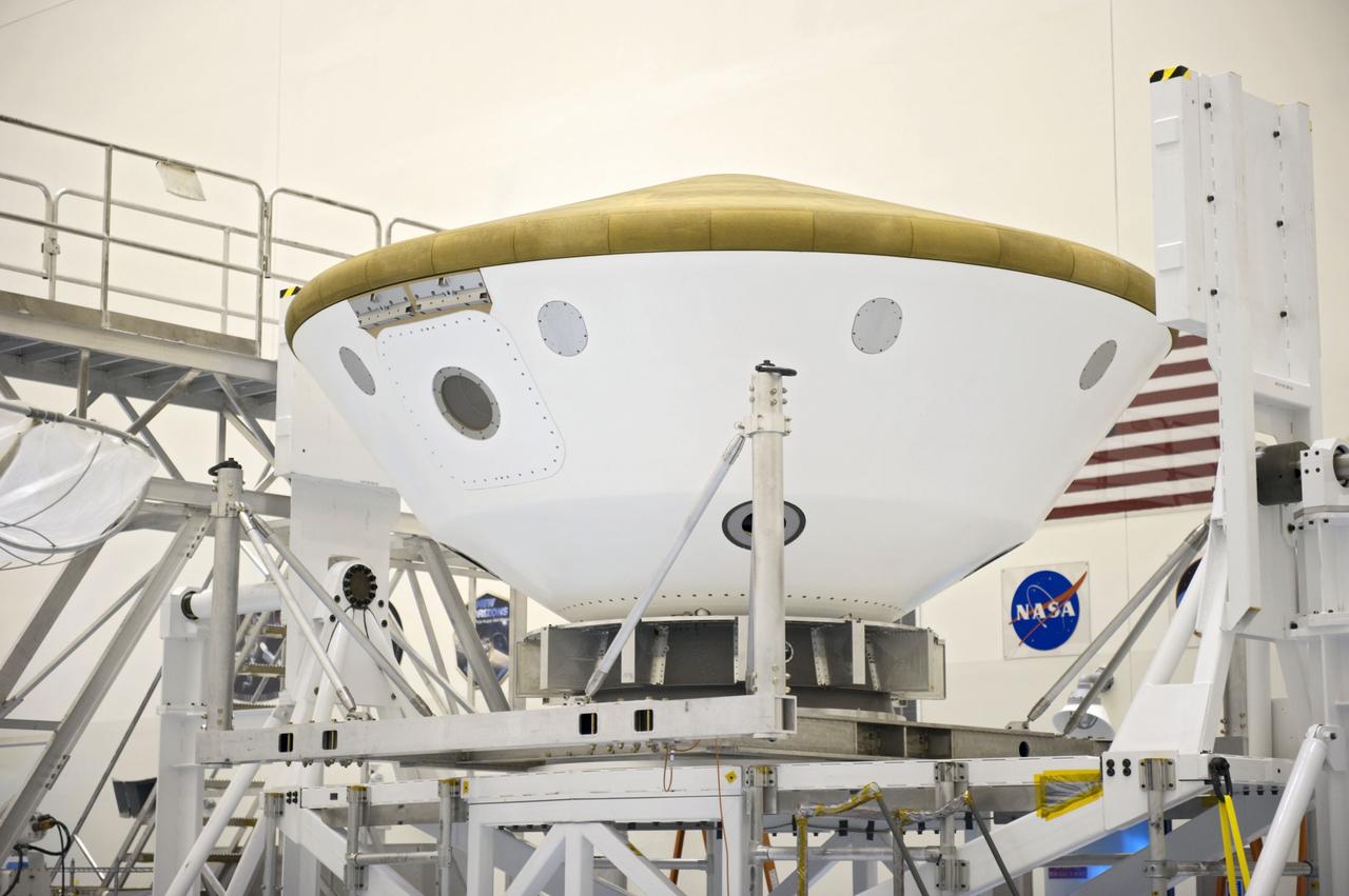 Cape Canaveral, Fla. -- At the Payload Hazardous Servicing Facility at NASA's Kennedy Space Center in Florida, technicians have moved the aeroshell, a component of NASA's Mars Science Laboratory (MSL), back to a work stand after a spin and balance test. The aeroshell consists of the backshell which carries the parachute and several components used during later stages of entry, descent and landing, and the spacecraft's heat shield. MSL's components include a compact car-sized rover, Curiosity, which has 10 science instruments designed to search for evidence on whether Mars has had environments favorable to microbial life, including chemical ingredients for life. The unique rover will use a laser to look inside rocks and release its gasses so that the rover’s spectrometer can analyze and send the data back to Earth. Launch of MSL aboard a United Launch Alliance Atlas V rocket is scheduled for Nov. 25 from Space Launch Complex 41 on Cape Canaveral Air Force Station in Florida. For more information, visit http://www.nasa.gov/msl. Photo credit: NASA/Kim Shiflett