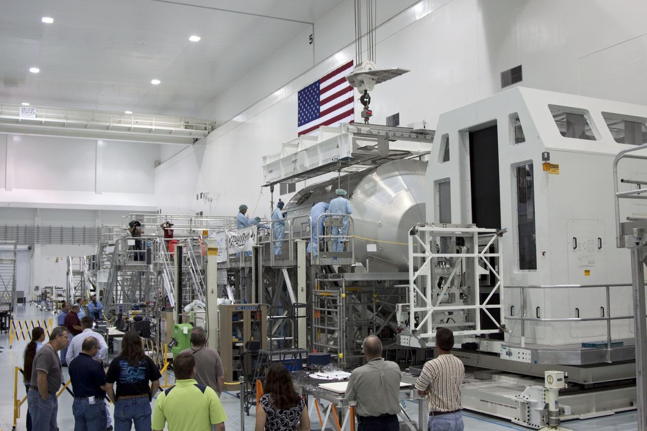 CAPE CANAVERAL, Fla. -- In the Space Station Processing Facility at NASA's Kennedy Space Center in Florida, technicians lower an overhead crane toward the Raffaello multi-purpose logistics module, or MPLM, for its move toward a payload canister. Commander Chris Ferguson, Pilot Doug Hurley and Mission Specialists Sandra Magnus and Rex Walheim are targeted to lift off on space shuttle Atlantis July 8, taking with them the MPLM packed with supplies, logistics and spare parts to the International Space Station. The STS-135 mission also will fly a system to investigate the potential for robotically refueling existing spacecraft and return a failed ammonia pump module to help NASA better understand the failure mechanism and improve pump designs for future systems. STS-135 will be the 33rd flight of Atlantis, the 37th shuttle mission to the space station, and the 135th and final mission of NASA's Space Shuttle Program. For more information, visit www.nasa.gov/mission_pages/shuttle/shuttlemissions/sts135/index.html. Photo credit: NASA/Jim Grossmann