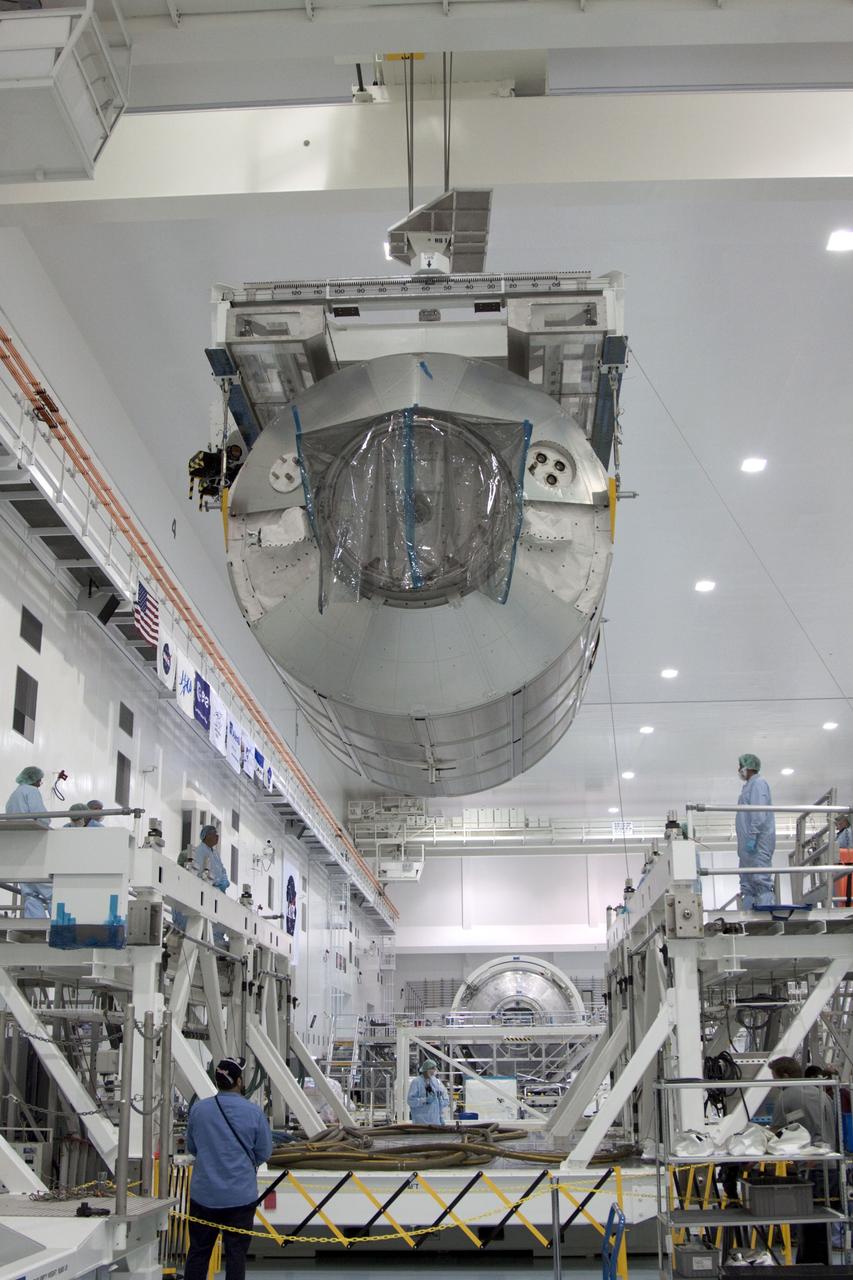 CAPE CANAVERAL, Fla. -- In the Space Station Processing Facility at NASA's Kennedy Space Center in Florida, an overhead crane moves the Raffaello multi-purpose logistics module, or MPLM, toward a payload canister.    Commander Chris Ferguson, Pilot Doug Hurley and Mission Specialists Sandra Magnus and Rex Walheim are targeted to lift off on space shuttle Atlantis July 8, taking with them the MPLM packed with supplies, logistics and spare parts to the International Space Station. The STS-135 mission also will fly a system to investigate the potential for robotically refueling existing spacecraft and return a failed ammonia pump module to help NASA better understand the failure mechanism and improve pump designs for future systems. STS-135 will be the 33rd flight of Atlantis, the 37th shuttle mission to the space station, and the 135th and final mission of NASA's Space Shuttle Program. For more information, visit www.nasa.gov/mission_pages/shuttle/shuttlemissions/sts135/index.html. Photo credit: NASA/Jim Grossmann