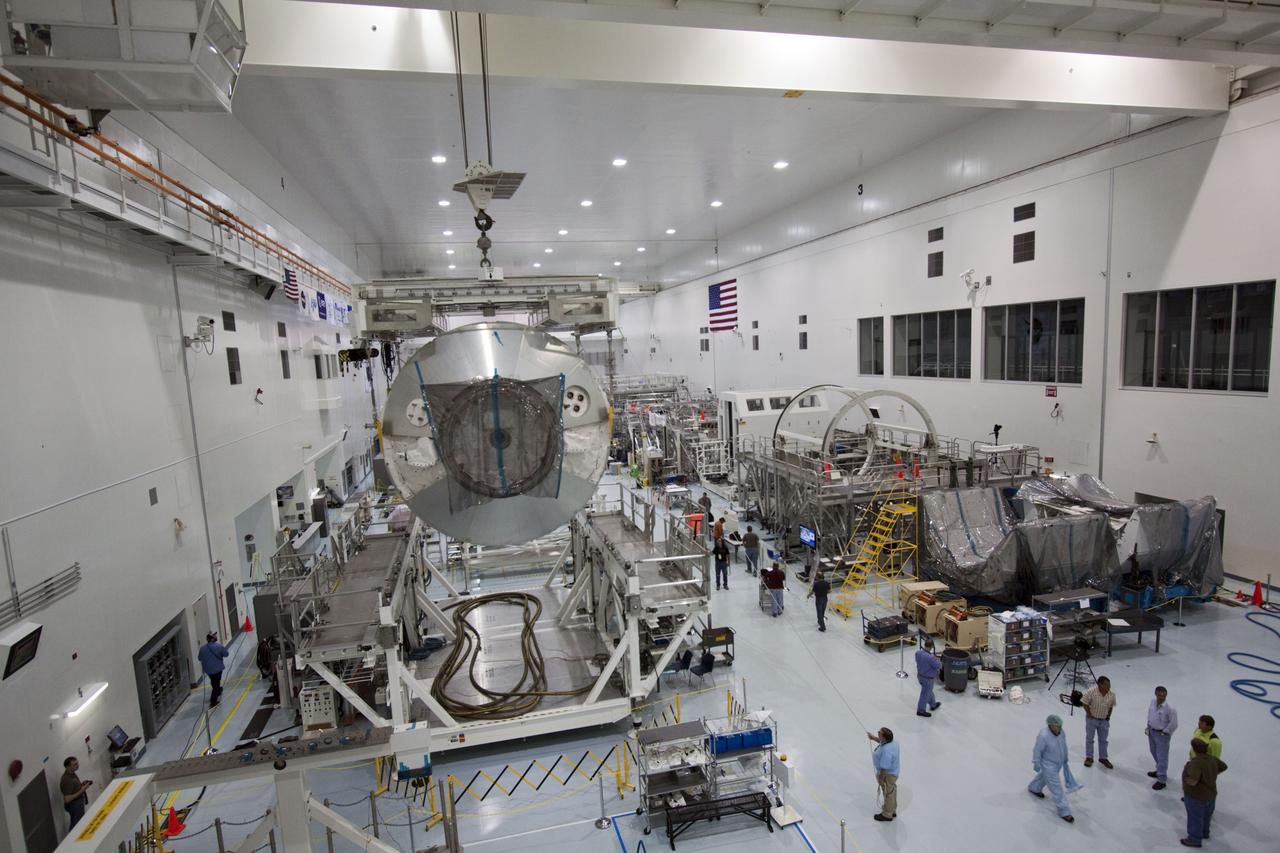 CAPE CANAVERAL, Fla. -- In the Space Station Processing Facility at NASA's Kennedy Space Center in Florida, an overhead crane moves the Raffaello multi-purpose logistics module, or MPLM, toward a payload canister.    Commander Chris Ferguson, Pilot Doug Hurley and Mission Specialists Sandra Magnus and Rex Walheim are targeted to lift off on space shuttle Atlantis July 8, taking with them the MPLM packed with supplies, logistics and spare parts to the International Space Station. The STS-135 mission also will fly a system to investigate the potential for robotically refueling existing spacecraft and return a failed ammonia pump module to help NASA better understand the failure mechanism and improve pump designs for future systems. STS-135 will be the 33rd flight of Atlantis, the 37th shuttle mission to the space station, and the 135th and final mission of NASA's Space Shuttle Program. For more information, visit www.nasa.gov/mission_pages/shuttle/shuttlemissions/sts135/index.html. Photo credit: NASA/Jim Grossmann