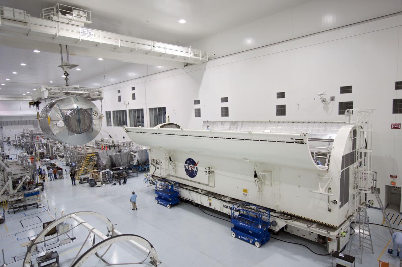 CAPE CANAVERAL, Fla. -- In the Space Station Processing Facility at NASA's Kennedy Space Center in Florida, an overhead crane moves the Raffaello multi-purpose logistics module, or MPLM, toward a payload canister.    Commander Chris Ferguson, Pilot Doug Hurley and Mission Specialists Sandra Magnus and Rex Walheim are targeted to lift off on space shuttle Atlantis July 8, taking with them the MPLM packed with supplies, logistics and spare parts to the International Space Station. The STS-135 mission also will fly a system to investigate the potential for robotically refueling existing spacecraft and return a failed ammonia pump module to help NASA better understand the failure mechanism and improve pump designs for future systems. STS-135 will be the 33rd flight of Atlantis, the 37th shuttle mission to the space station, and the 135th and final mission of NASA's Space Shuttle Program. For more information, visit www.nasa.gov/mission_pages/shuttle/shuttlemissions/sts135/index.html. Photo credit: NASA/Jim Grossmann
