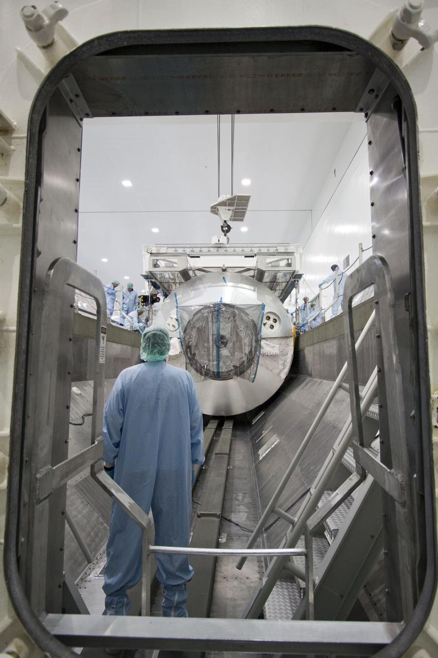 CAPE CANAVERAL, Fla. -- In the Space Station Processing Facility at NASA's Kennedy Space Center in Florida, technicians guide an overhead crane as it lowers the Raffaello multi-purpose logistics module, or MPLM, into a payload canister. Commander Chris Ferguson, Pilot Doug Hurley and Mission Specialists Sandra Magnus and Rex Walheim are targeted to lift off on space shuttle Atlantis July 8, taking with them the MPLM packed with supplies, logistics and spare parts to the International Space Station. The STS-135 mission also will fly a system to investigate the potential for robotically refueling existing spacecraft and return a failed ammonia pump module to help NASA better understand the failure mechanism and improve pump designs for future systems. STS-135 will be the 33rd flight of Atlantis, the 37th shuttle mission to the space station, and the 135th and final mission of NASA's Space Shuttle Program. For more information, visit www.nasa.gov/mission_pages/shuttle/shuttlemissions/sts135/index.html. Photo credit: NASA/Jim Grossmann