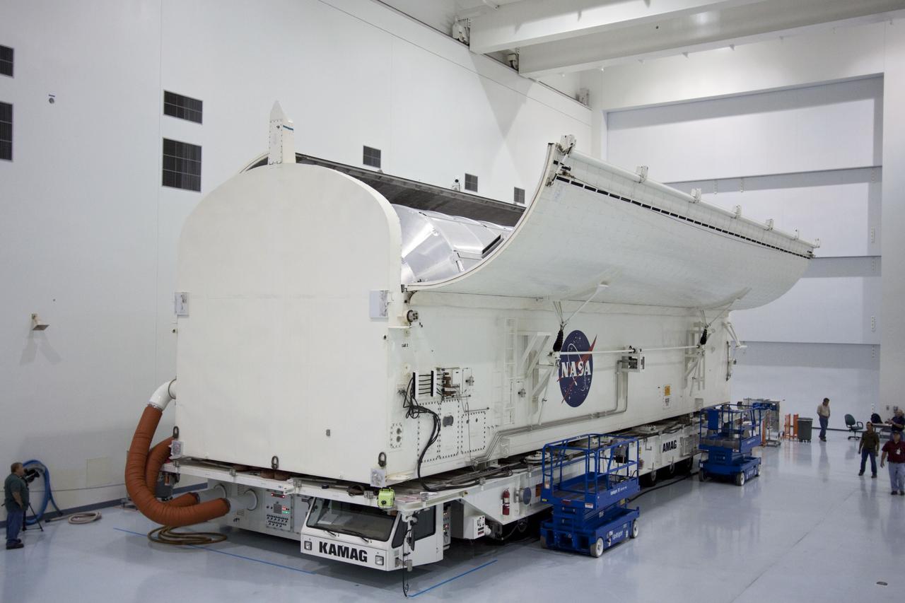 CAPE CANAVERAL, Fla. -- In the Space Station Processing Facility at NASA's Kennedy Space Center in Florida, the clamshell doors on the canister atop its transporter close around the Raffaello multi-purpose logistics module, or MPLM, secured inside.    Commander Chris Ferguson, Pilot Doug Hurley and Mission Specialists Sandra Magnus and Rex Walheim are targeted to lift off on space shuttle Atlantis July 8, taking with them the MPLM packed with supplies, logistics and spare parts to the International Space Station. The STS-135 mission also will fly a system to investigate the potential for robotically refueling existing spacecraft and return a failed ammonia pump module to help NASA better understand the failure mechanism and improve pump designs for future systems. STS-135 will be the 33rd flight of Atlantis, the 37th shuttle mission to the space station, and the 135th and final mission of NASA's Space Shuttle Program. For more information, visit www.nasa.gov/mission_pages/shuttle/shuttlemissions/sts135/index.html. Photo credit: NASA/Jim Grossmann