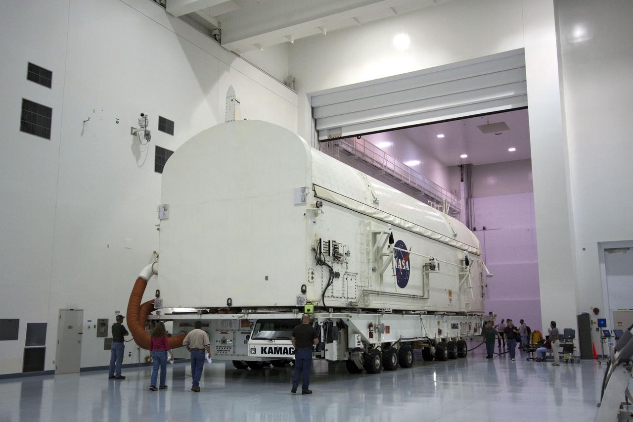 CAPE CANAVERAL, Fla. -- Workers in the Space Station Processing Facility at NASA's Kennedy Space Center in Florida prepare to move the payload canister, atop its transporter with the Raffaello multi-purpose logistics module, or MPLM, secured inside, to the Canister Rotation Facility.    Commander Chris Ferguson, Pilot Doug Hurley and Mission Specialists Sandra Magnus and Rex Walheim are targeted to lift off on space shuttle Atlantis July 8, taking with them the MPLM packed with supplies, logistics and spare parts to the International Space Station. The STS-135 mission also will fly a system to investigate the potential for robotically refueling existing spacecraft and return a failed ammonia pump module to help NASA better understand the failure mechanism and improve pump designs for future systems. STS-135 will be the 33rd flight of Atlantis, the 37th shuttle mission to the space station, and the 135th and final mission of NASA's Space Shuttle Program. For more information, visit www.nasa.gov/mission_pages/shuttle/shuttlemissions/sts135/index.html. Photo credit: NASA/Jim Grossmann