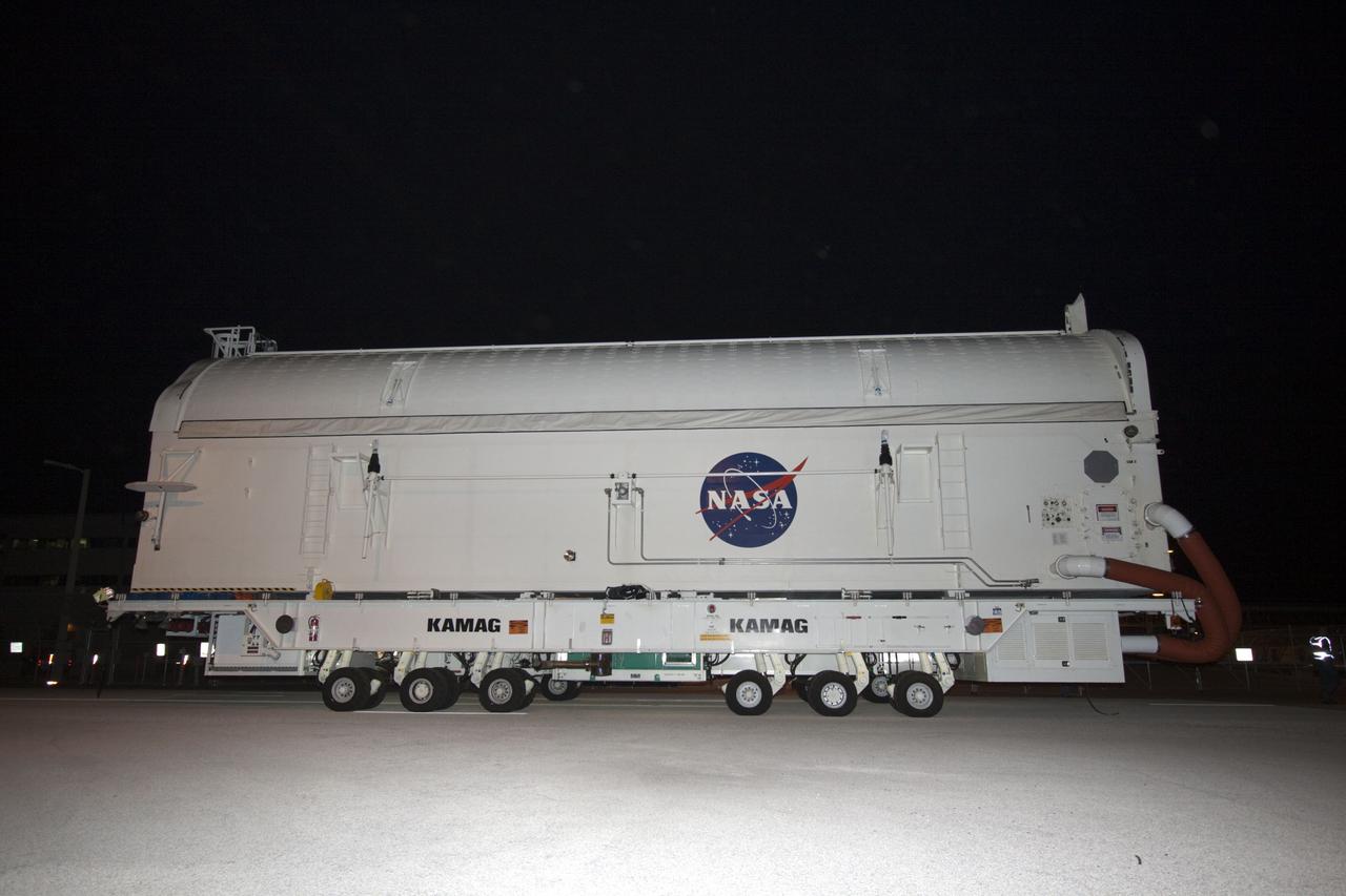 CAPE CANAVERAL, Fla. -- Workers move the payload canister, atop its transporter with the Raffaello multi-purpose logistics module, or MPLM, secured inside, from the Space Station Processing Facility at NASA's Kennedy Space Center in Florida to the Canister Rotation Facility. Commander Chris Ferguson, Pilot Doug Hurley and Mission Specialists Sandra Magnus and Rex Walheim are targeted to lift off on space shuttle Atlantis July 8, taking with them the MPLM packed with supplies, logistics and spare parts to the International Space Station. The STS-135 mission also will fly a system to investigate the potential for robotically refueling existing spacecraft and return a failed ammonia pump module to help NASA better understand the failure mechanism and improve pump designs for future systems. STS-135 will be the 33rd flight of Atlantis, the 37th shuttle mission to the space station, and the 135th and final mission of NASA's Space Shuttle Program. For more information, visit www.nasa.gov/mission_pages/shuttle/shuttlemissions/sts135/index.html. Photo credit: NASA/Jim Grossmann