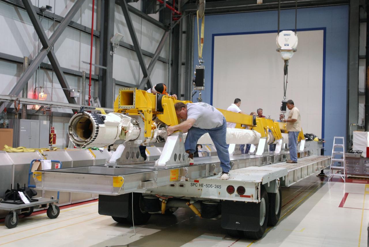 CAPE CANAVERAL, Fla. -- In Orbiter Processing Facility-1 at NASA's Kennedy Space Center in Florida, workers secure the remote manipulator system, or RMS, in a transportation canister following its removal from space shuttle Endeavour's payload bay.     The removal is part of Endeavour's transition and retirement processing. Endeavour is being prepared for public display at the California Science Center in Los Angeles. Endeavour flew 25 missions, spent 299 days in space, orbited Earth 4,671 times and traveled 122,883,151 miles over the course of its 19-year career.  Photo credit: NASA/Tim Jacobs