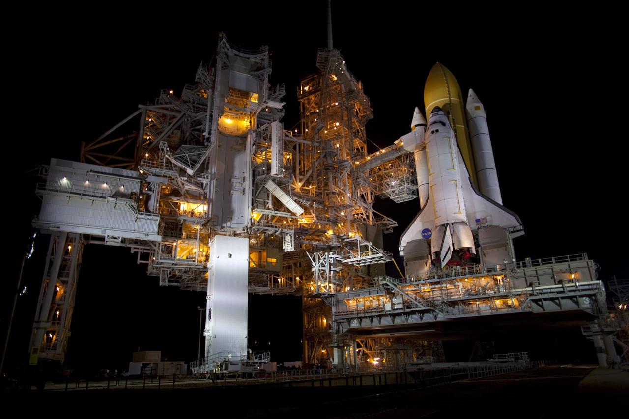 CAPE CANAVERAL, Fla. -- A canister, carrying the Raffaello multi-purpose logistics module (MPLM) for space shuttle Atlantis' STS-135 mission to the International Space Station, arrives at Launch Pad 39A at NASA's Kennedy Space Center in Florida. The canister will be lifted to the payload changeout room. The payload ground-handling mechanism then will be used to transfer Raffaello out of the canister into Atlantis' payload bay. Next, the rotating service structure that protects the shuttle from the elements and provides access will be rotated back into place.              Commander Chris Ferguson, Pilot Doug Hurley and Mission Specialists Sandra Magnus and Rex Walheim are targeted to lift off on Atlantis July 8, taking with them the MPLM packed with supplies, logistics and spare parts to the station. The STS-135 mission also will fly a system to investigate the potential for robotically refueling existing satellites and return a failed ammonia pump module to help NASA better understand the failure mechanism and improve pump designs for future systems. STS-135 will be the 33rd flight of Atlantis, the 37th shuttle mission to the space station, and the 135th and final mission of NASA's Space Shuttle Program. For more information visit, www.nasa.gov/mission_pages/shuttle/shuttlemissions/sts135/index.html. Photo credit: NASA/Dimitri Gerondidakis