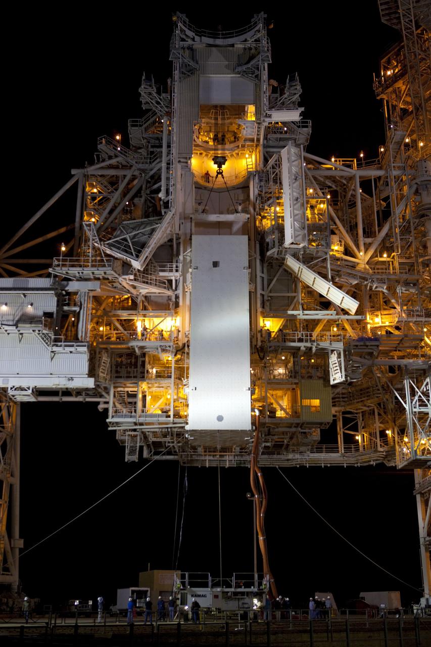 CAPE CANAVERAL, Fla. -- The payload canister carrying the Raffaello multi-purpose logistics module (MPLM) is lifted to the payload changeout room on the rotating service structure (RSS) on Launch Pad 39A at NASA's Kennedy Space Center in Florida. Umbilical hoses, maintaining a controlled environment for the cargo are attached to the lower end of the canister. The payload ground-handling mechanism then will be used to transfer Raffaello out of the canister into Atlantis' payload bay. Next, the RSS that protects the shuttle from the elements and provides access will be rotated back into place.            Commander Chris Ferguson, Pilot Doug Hurley and Mission Specialists Sandra Magnus and Rex Walheim are targeted to lift off on Atlantis July 8, taking with them the MPLM packed with supplies, logistics and spare parts to the station. The STS-135 mission also will fly a system to investigate the potential for robotically refueling existing satellites and return a failed ammonia pump module to help NASA better understand the failure mechanism and improve pump designs for future systems. STS-135 will be the 33rd flight of Atlantis, the 37th shuttle mission to the space station, and the 135th and final mission of NASA's Space Shuttle Program. For more information visit, www.nasa.gov/mission_pages/shuttle/shuttlemissions/sts135/index.html. Photo credit: NASA/Dimitri Gerondidakis