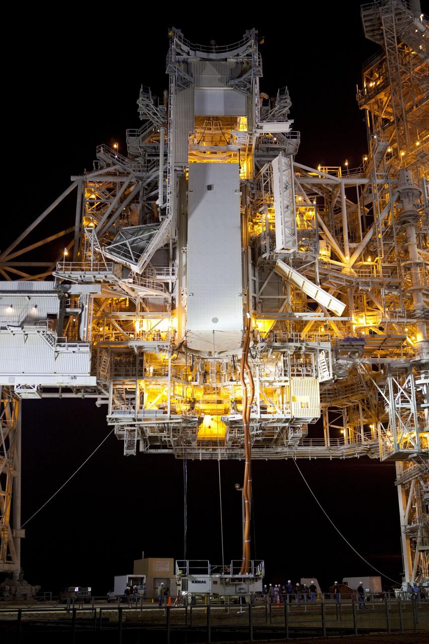 CAPE CANAVERAL, Fla. -- The payload canister carrying the Raffaello multi-purpose logistics module (MPLM) is lifted to the payload changeout room on the rotating service structure (RSS) on Launch Pad 39A at NASA's Kennedy Space Center in Florida. Umbilical hoses, maintaining a controlled environment for the cargo are attached to the lower end of the canister. The payload ground-handling mechanism then will be used to transfer Raffaello out of the canister into Atlantis' payload bay. Next, the RSS that protects the shuttle from the elements and provides access will be rotated back into place.            Commander Chris Ferguson, Pilot Doug Hurley and Mission Specialists Sandra Magnus and Rex Walheim are targeted to lift off on Atlantis July 8, taking with them the MPLM packed with supplies, logistics and spare parts to the station. The STS-135 mission also will fly a system to investigate the potential for robotically refueling existing satellites and return a failed ammonia pump module to help NASA better understand the failure mechanism and improve pump designs for future systems. STS-135 will be the 33rd flight of Atlantis, the 37th shuttle mission to the space station, and the 135th and final mission of NASA's Space Shuttle Program. For more information visit, www.nasa.gov/mission_pages/shuttle/shuttlemissions/sts135/index.html. Photo credit: NASA/Dimitri Gerondidakis