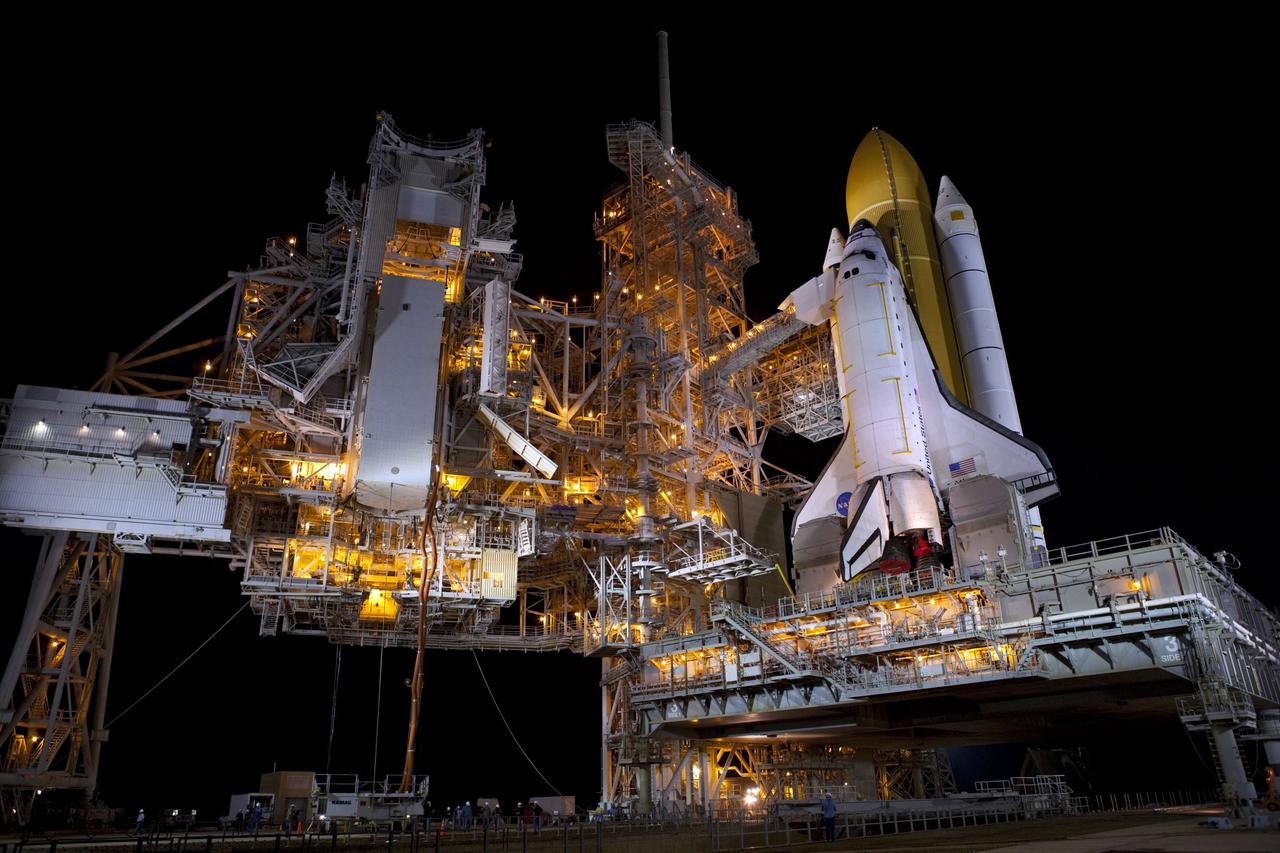 CAPE CANAVERAL, Fla. -- The payload canister carrying the Raffaello multi-purpose logistics module (MPLM) is lifted to the payload changeout room on the rotating service structure (RSS) on Launch Pad 39A at NASA's Kennedy Space Center in Florida. Umbilical hoses, maintaining a controlled environment for the cargo are attached to the lower end of the canister. The payload ground-handling mechanism then will be used to transfer Raffaello out of the canister into Atlantis' payload bay. Next, the RSS that protects the shuttle from the elements and provides access will be rotated back into place.            Commander Chris Ferguson, Pilot Doug Hurley and Mission Specialists Sandra Magnus and Rex Walheim are targeted to lift off on Atlantis July 8, taking with them the MPLM packed with supplies, logistics and spare parts to the station. The STS-135 mission also will fly a system to investigate the potential for robotically refueling existing satellites and return a failed ammonia pump module to help NASA better understand the failure mechanism and improve pump designs for future systems. STS-135 will be the 33rd flight of Atlantis, the 37th shuttle mission to the space station, and the 135th and final mission of NASA's Space Shuttle Program. For more information visit, www.nasa.gov/mission_pages/shuttle/shuttlemissions/sts135/index.html. Photo credit: NASA/Dimitri Gerondidakis
