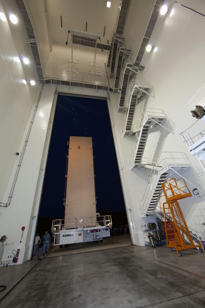 CAPE CANAVERAL, Fla. -- The container that carries the Raffaello multi-purpose logistics module (MPLM), secured on its transportation vehicle, begins its journey from the Canister Rotation Facility to Launch Pad 39A at NASA's Kennedy Space Center in Florida. Once there, the canister will be lifted to the payload changeout room. The payload ground-handling mechanism then will be used to transfer Raffaello out of the canister into space shuttle Atlantis' payload bay. Next, the rotating service structure that protects the shuttle from the elements and provides access will be rotated back into place.                Commander Chris Ferguson, Pilot Doug Hurley and Mission Specialists Sandra Magnus and Rex Walheim are targeted to lift off on Atlantis July 8, taking with them the MPLM packed with supplies, logistics and spare parts to the station. The STS-135 mission also will fly a system to investigate the potential for robotically refueling existing satellites and return a failed ammonia pump module to help NASA better understand the failure mechanism and improve pump designs for future systems. STS-135 will be the 33rd flight of Atlantis, the 37th shuttle mission to the space station, and the 135th and final mission of NASA's Space Shuttle Program. For more information visit, www.nasa.gov/mission_pages/shuttle/shuttlemissions/sts135/index.html. Photo credit: NASA/Frank Michaux