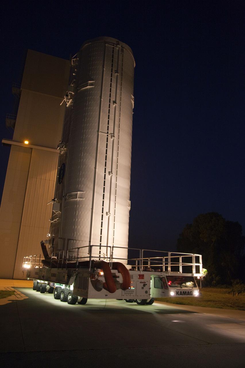 CAPE CANAVERAL, Fla. -- The container that carries the Raffaello multi-purpose logistics module (MPLM), secured on its transportation vehicle, begins its journey from the Canister Rotation Facility to Launch Pad 39A at NASA's Kennedy Space Center in Florida. Once there, the canister will be lifted to the payload changeout room. The payload ground-handling mechanism then will be used to transfer Raffaello out of the canister into space shuttle Atlantis' payload bay. Next, the rotating service structure that protects the shuttle from the elements and provides access will be rotated back into place.                Commander Chris Ferguson, Pilot Doug Hurley and Mission Specialists Sandra Magnus and Rex Walheim are targeted to lift off on Atlantis July 8, taking with them the MPLM packed with supplies, logistics and spare parts to the station. The STS-135 mission also will fly a system to investigate the potential for robotically refueling existing satellites and return a failed ammonia pump module to help NASA better understand the failure mechanism and improve pump designs for future systems. STS-135 will be the 33rd flight of Atlantis, the 37th shuttle mission to the space station, and the 135th and final mission of NASA's Space Shuttle Program. For more information visit, www.nasa.gov/mission_pages/shuttle/shuttlemissions/sts135/index.html. Photo credit: NASA/Frank Michaux