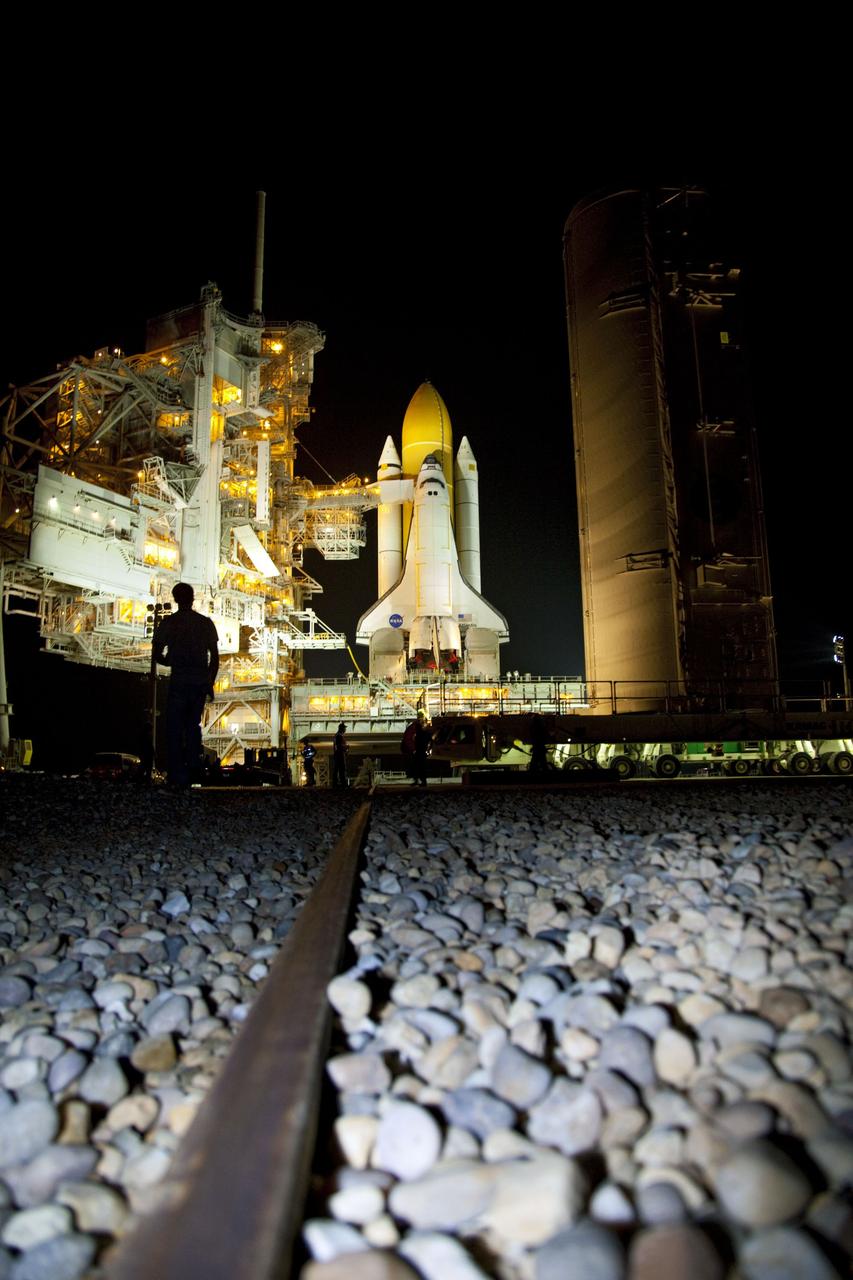 CAPE CANAVERAL, Fla. -- A canister, carrying the Raffaello multi-purpose logistics module (MPLM) for space shuttle Atlantis' STS-135 mission to the International Space Station, arrives at Launch Pad 39A at NASA's Kennedy Space Center in Florida. The canister will be lifted to the payload changeout room. The payload ground-handling mechanism then will be used to transfer Raffaello out of the canister into Atlantis' payload bay. Next, the rotating service structure that protects the shuttle from the elements and provides access will be rotated back into place.              Commander Chris Ferguson, Pilot Doug Hurley and Mission Specialists Sandra Magnus and Rex Walheim are targeted to lift off on Atlantis July 8, taking with them the MPLM packed with supplies, logistics and spare parts to the station. The STS-135 mission also will fly a system to investigate the potential for robotically refueling existing satellites and return a failed ammonia pump module to help NASA better understand the failure mechanism and improve pump designs for future systems. STS-135 will be the 33rd flight of Atlantis, the 37th shuttle mission to the space station, and the 135th and final mission of NASA's Space Shuttle Program. For more information visit, www.nasa.gov/mission_pages/shuttle/shuttlemissions/sts135/index.html. Photo credit: NASA/Frank Michaux