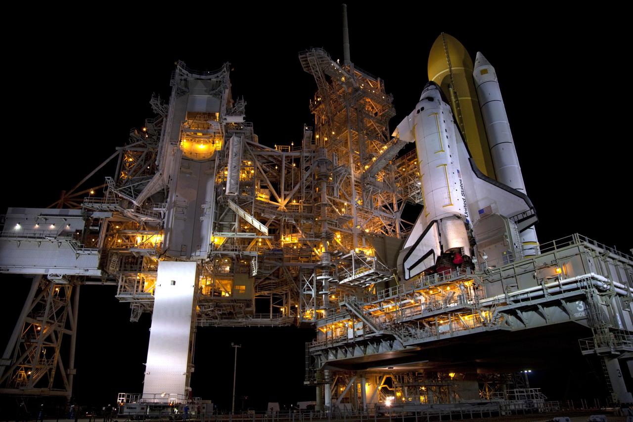 CAPE CANAVERAL, Fla. -- A canister, carrying the Raffaello multi-purpose logistics module (MPLM) for space shuttle Atlantis' STS-135 mission to the International Space Station, arrives at Launch Pad 39A at NASA's Kennedy Space Center in Florida. The canister will be lifted to the payload changeout room. The payload ground-handling mechanism then will be used to transfer Raffaello out of the canister into Atlantis' payload bay. Next, the rotating service structure that protects the shuttle from the elements and provides access will be rotated back into place.              Commander Chris Ferguson, Pilot Doug Hurley and Mission Specialists Sandra Magnus and Rex Walheim are targeted to lift off on Atlantis July 8, taking with them the MPLM packed with supplies, logistics and spare parts to the station. The STS-135 mission also will fly a system to investigate the potential for robotically refueling existing satellites and return a failed ammonia pump module to help NASA better understand the failure mechanism and improve pump designs for future systems. STS-135 will be the 33rd flight of Atlantis, the 37th shuttle mission to the space station, and the 135th and final mission of NASA's Space Shuttle Program. For more information visit, www.nasa.gov/mission_pages/shuttle/shuttlemissions/sts135/index.html. Photo credit: NASA/Frank Michaux
