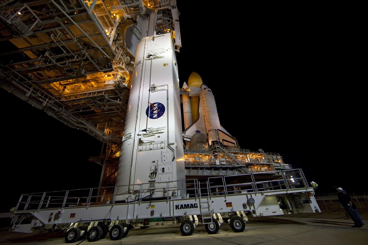 CAPE CANAVERAL, Fla. -- A canister, carrying the Raffaello multi-purpose logistics module (MPLM) for space shuttle Atlantis' STS-135 mission to the International Space Station, arrives at Launch Pad 39A at NASA's Kennedy Space Center in Florida. The canister will be lifted to the payload changeout room. The payload ground-handling mechanism then will be used to transfer Raffaello out of the canister into Atlantis' payload bay. Next, the rotating service structure that protects the shuttle from the elements and provides access will be rotated back into place. Commander Chris Ferguson, Pilot Doug Hurley and Mission Specialists Sandra Magnus and Rex Walheim are targeted to lift off on Atlantis July 8, taking with them the MPLM packed with supplies, logistics and spare parts to the station. The STS-135 mission also will fly a system to investigate the potential for robotically refueling existing satellites and return a failed ammonia pump module to help NASA better understand the failure mechanism and improve pump designs for future systems. STS-135 will be the 33rd flight of Atlantis, the 37th shuttle mission to the space station, and the 135th and final mission of NASA's Space Shuttle Program. For more information visit, www.nasa.gov/mission_pages/shuttle/shuttlemissions/sts135/index.html. Photo credit: NASA/Frank Michaux
