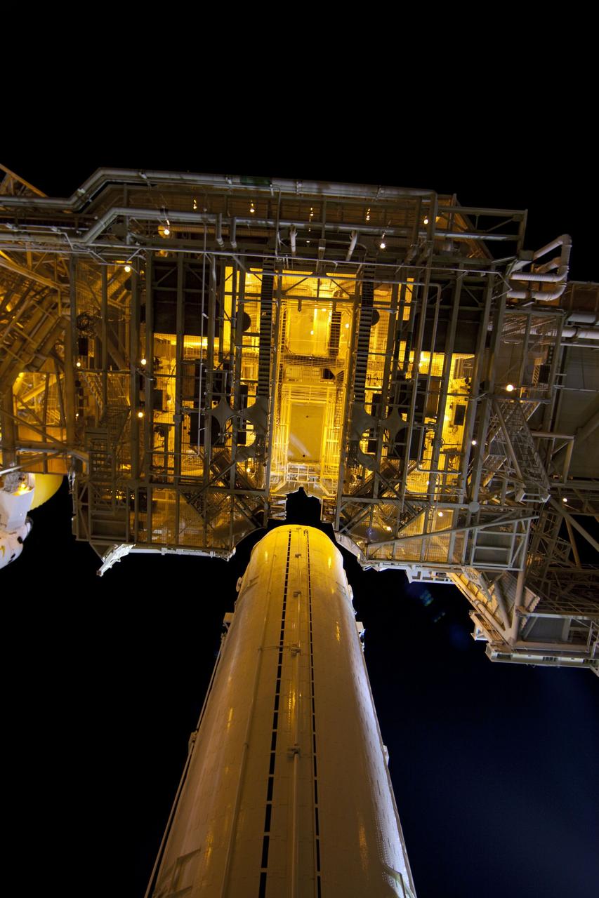 CAPE CANAVERAL, Fla. -- A canister, carrying the Raffaello multi-purpose logistics module (MPLM) for space shuttle Atlantis' STS-135 mission to the International Space Station, arrives at Launch Pad 39A at NASA's Kennedy Space Center in Florida. The canister will be lifted to the payload changeout room. The payload ground-handling mechanism then will be used to transfer Raffaello out of the canister into Atlantis' payload bay. Next, the rotating service structure that protects the shuttle from the elements and provides access will be rotated back into place.              Commander Chris Ferguson, Pilot Doug Hurley and Mission Specialists Sandra Magnus and Rex Walheim are targeted to lift off on Atlantis July 8, taking with them the MPLM packed with supplies, logistics and spare parts to the station. The STS-135 mission also will fly a system to investigate the potential for robotically refueling existing satellites and return a failed ammonia pump module to help NASA better understand the failure mechanism and improve pump designs for future systems. STS-135 will be the 33rd flight of Atlantis, the 37th shuttle mission to the space station, and the 135th and final mission of NASA's Space Shuttle Program. For more information visit, www.nasa.gov/mission_pages/shuttle/shuttlemissions/sts135/index.html. Photo credit: NASA/Frank Michaux