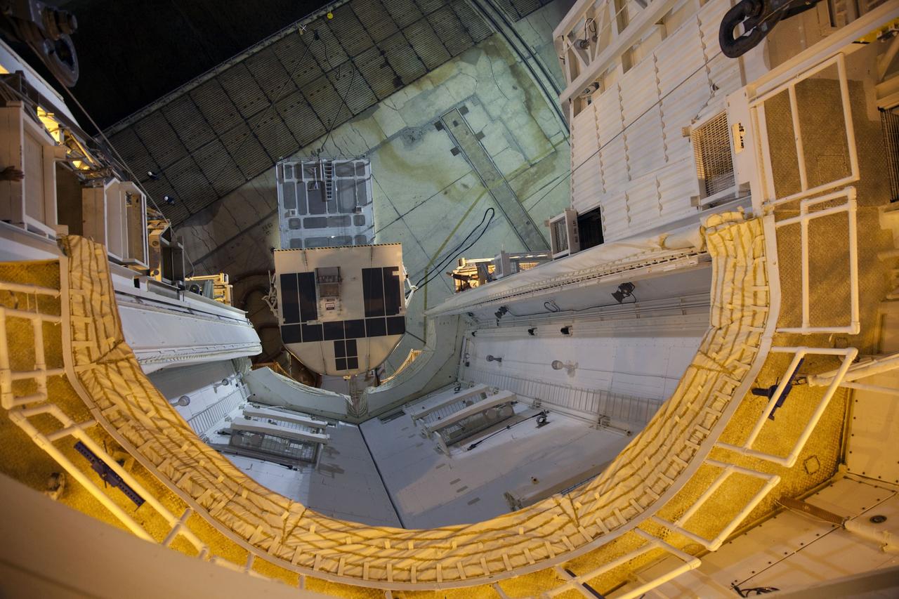 CAPE CANAVERAL, Fla. -- On Launch Pad 39A at NASA's Kennedy Space Center in Florida, the Raffaello multi-purpose logistics module (MPLM) payload for space shuttle Atlantis' STS-135 mission to the International Space Station can be seen from inside the payload changeout room (PCR). The payload canister will be lifted to the PCR and the payload ground-handling mechanism then will be used to transfer Raffaello out of the canister into Atlantis' payload bay. Next, the rotating service structure that protects the shuttle from the elements and provides access will be rotated back into place.          Commander Chris Ferguson, Pilot Doug Hurley and Mission Specialists Sandra Magnus and Rex Walheim are targeted to lift off on Atlantis July 8, taking with them the MPLM packed with supplies, logistics and spare parts to the station. The STS-135 mission also will fly a system to investigate the potential for robotically refueling existing satellites and return a failed ammonia pump module to help NASA better understand the failure mechanism and improve pump designs for future systems. STS-135 will be the 33rd flight of Atlantis, the 37th shuttle mission to the space station, and the 135th and final mission of NASA's Space Shuttle Program. For more information visit, www.nasa.gov/mission_pages/shuttle/shuttlemissions/sts135/index.html. Photo credit: NASA/Frank Michaux