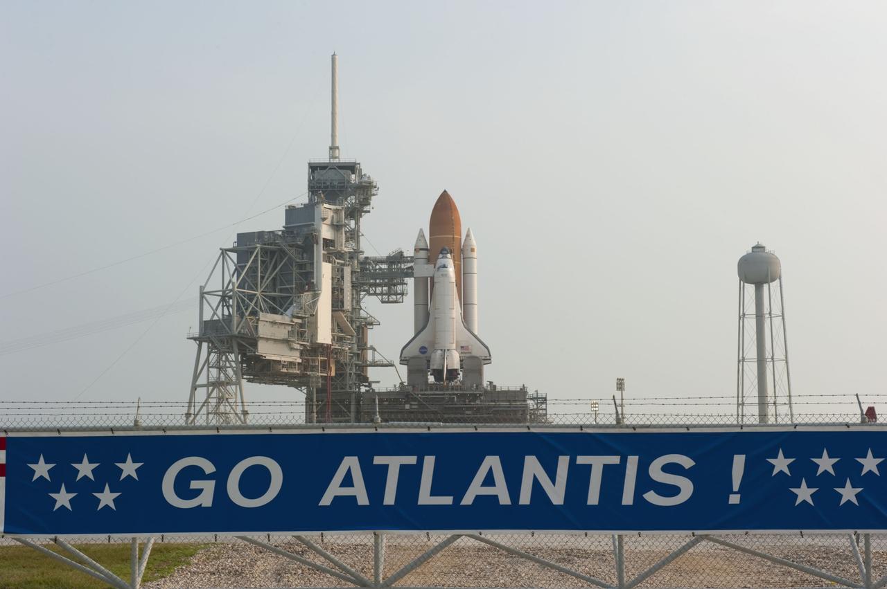 CAPE CANAVERAL, Fla. -- On Launch Pad 39A at NASA's Kennedy Space Center in Florida, the access arm supporting the pad's White Room is in place against space shuttle Atlantis. The room provides workers and astronauts an entry point to the shuttle's crew compartment. The Raffaello multi-purpose logistics module (MPLM) payload for space shuttle Atlantis' STS-135 mission to the International Space Station has arrived at the pad. The payload canister will be lifted to the payload changeout room and the payload ground-handling mechanism then will be used to transfer Raffaello out of the canister into Atlantis' payload bay. Next, the rotating service structure that protects the shuttle from the elements and provides access will be rotated back into place.        Commander Chris Ferguson, Pilot Doug Hurley and Mission Specialists Sandra Magnus and Rex Walheim are targeted to lift off on space shuttle Atlantis July 8, taking with them the MPLM packed with supplies, logistics and spare parts to the International Space Station. The STS-135 mission also will fly a system to investigate the potential for robotically refueling existing satellites and return a failed ammonia pump module to help NASA better understand the failure mechanism and improve pump designs for future systems. STS-135 will be the 33rd flight of Atlantis, the 37th shuttle mission to the space station, and the 135th and final mission of NASA's Space Shuttle Program. For more information visit, www.nasa.gov/mission_pages/shuttle/shuttlemissions/sts135/index.html. Photo credit: NASA/Kim Shiflett