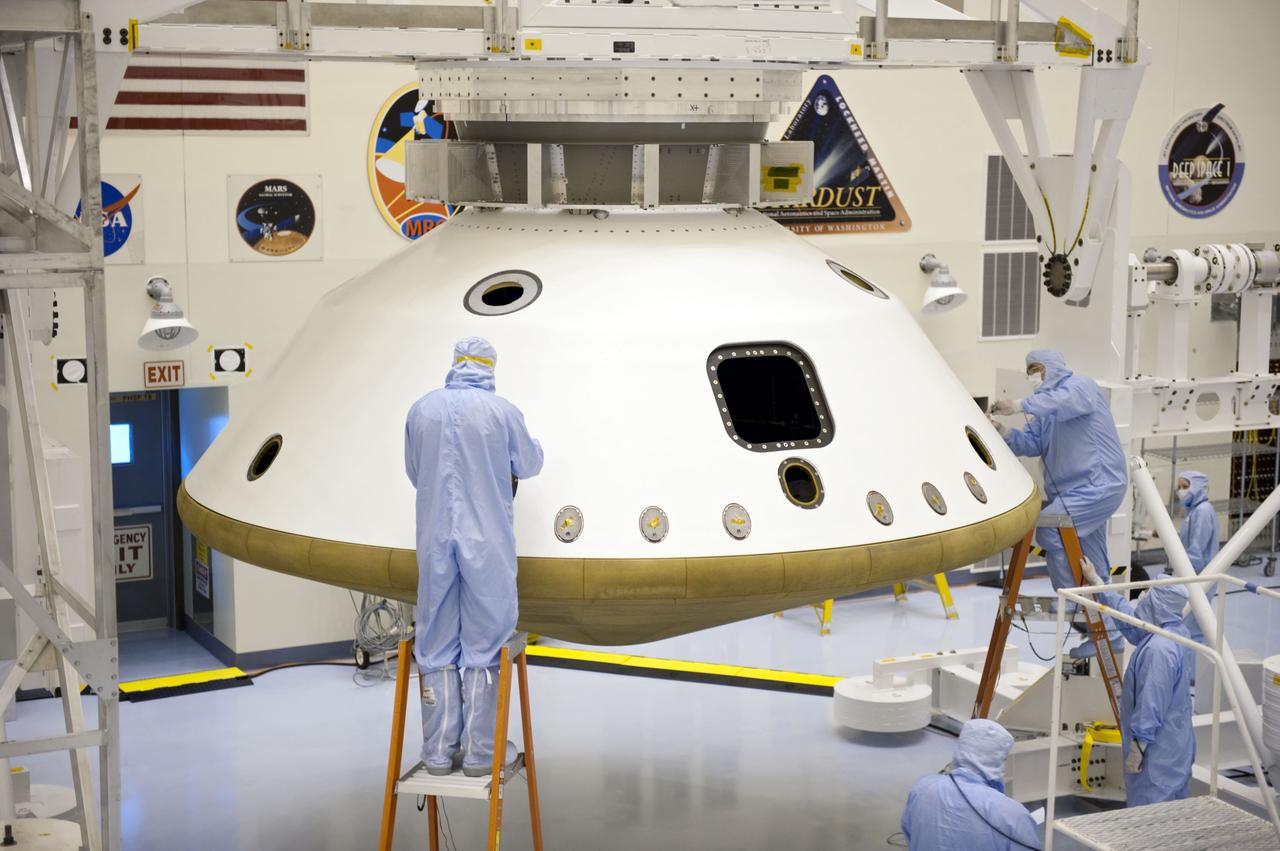 Cape Canaveral, Fla. -- At the Payload Hazardous Servicing Facility at NASA's Kennedy Space Center in Florida, technicians prepare to separate the two components of the aeroshell, an element of NASA's Mars Science Laboratory (MSL), after testing. The aeroshell consists of the spacecraft's heat shield and the backshell which carries the parachute and several components used during later stages of entry, descent and landing. MSL's components include a compact car-sized rover, Curiosity, which has 10 science instruments designed to search for evidence on whether Mars has had environments favorable to microbial life, including chemical ingredients for life. The unique rover will use a laser to look inside rocks and release its gasses so that the rover’s spectrometer can analyze and send the data back to Earth. Launch of MSL aboard a United Launch Alliance Atlas V rocket is scheduled for Nov. 25 from Space Launch Complex 41 on Cape Canaveral Air Force Station in Florida. For more information, visit http://www.nasa.gov/msl. Photo credit: NASA/Kim Shiflett