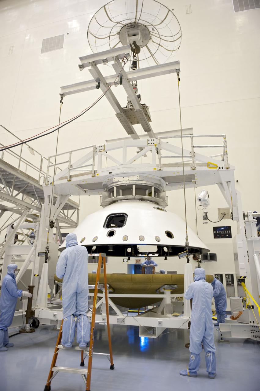 Cape Canaveral, Fla. -- At the Payload Hazardous Servicing Facility at NASA's Kennedy Space Center in Florida, technicians, using an overhead crane, separate the two components of the aeroshell, an element of NASA's Mars Science Laboratory (MSL), after testing. The aeroshell consists of the spacecraft's heat shield and the backshell which carries the parachute and several components used during later stages of entry, descent and landing. MSL's components include a compact car-sized rover, Curiosity, which has 10 science instruments designed to search for evidence on whether Mars has had environments favorable to microbial life, including chemical ingredients for life. The unique rover will use a laser to look inside rocks and release its gasses so that the rover’s spectrometer can analyze and send the data back to Earth. Launch of MSL aboard a United Launch Alliance Atlas V rocket is scheduled for Nov. 25 from Space Launch Complex 41 on Cape Canaveral Air Force Station in Florida. For more information, visit http://www.nasa.gov/msl. Photo credit: NASA/Kim Shiflett