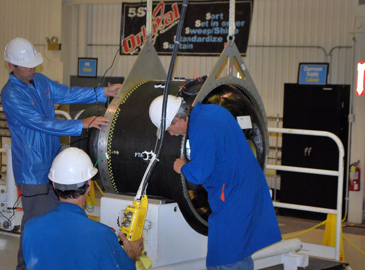 VANDENBERG AIR FORCE BASE, Calif. -- At Vandenberg Air Force Base in California, Orbital Sciences Corp. technicians prepare to weigh stage 3 of the Pegasus XL rocket motor that will launch the Nuclear Spectroscopic Telescope Array (NuSTAR) into space.      After the rocket and spacecraft are processed at Vandenberg, they will be flown on the Orbital Sciences' L-1011 carrier aircraft to the Ronald Reagan Ballistic Missile Defense Test Site located at the Pacific Ocean’s Kwajalein Atoll for launch. The high-energy X-ray telescope will conduct a census for black holes, map radioactive material in young supernovae remnants, and study the origins of cosmic rays and the extreme physics around collapsed stars. Photo credit: NASA/Randy Beaudoin, VAFB