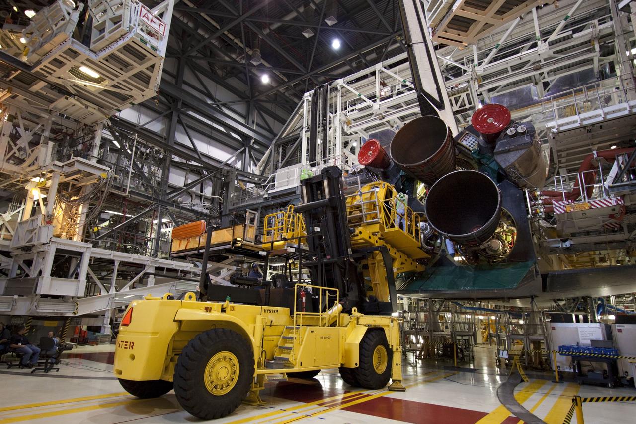 CAPE CANAVERAL, Fla. -- In Orbiter Processing Facility-1 at NASA's Kennedy Space Center in Florida, technicians carefully remove engine No. 2, one of three space shuttle main engines from Endeavour, using a specially designed engine installer, called a Hyster forklift. The removal is part of Endeavour's transition and retirement processing. Endeavour is being prepared for public display at the California Science Center in Los Angeles. Endeavour flew 25 missions, spent 299 days in space, orbited Earth 4,671 times and traveled 122,883,151 miles over the course of its 19-year career. Photo credit: NASA/Jim Grossmann