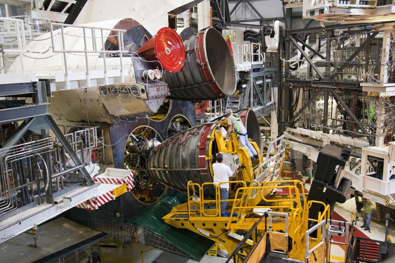 CAPE CANAVERAL, Fla. -- In Orbiter Processing Facility-1 at NASA's Kennedy Space Center in Florida, technicians carefully remove engine No. 2, one of three space shuttle main engines from Endeavour, using a specially designed engine installer, called a Hyster forklift. The removal is part of Endeavour's transition and retirement processing. Endeavour is being prepared for public display at the California Science Center in Los Angeles. Endeavour flew 25 missions, spent 299 days in space, orbited Earth 4,671 times and traveled 122,883,151 miles over the course of its 19-year career. Photo credit: NASA/Jim Grossmann