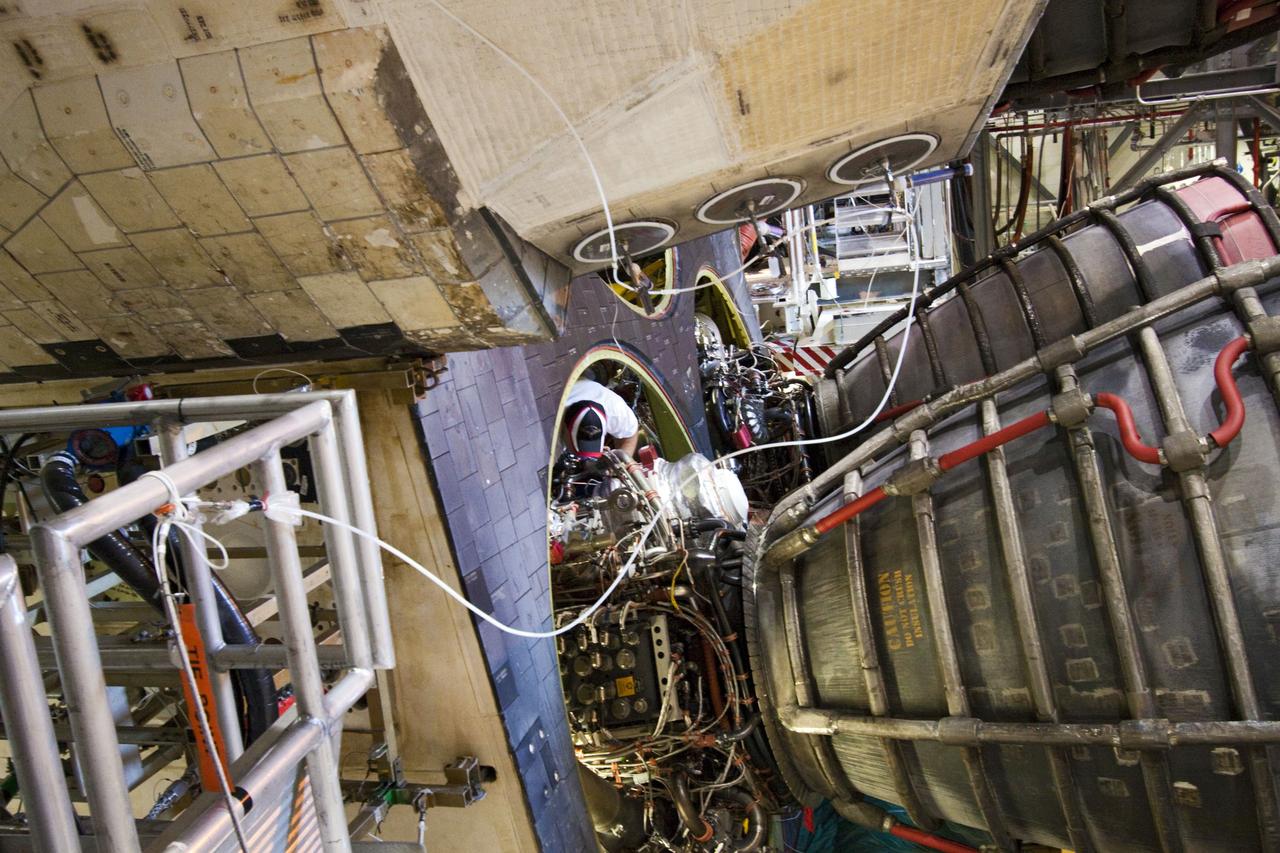 CAPE CANAVERAL, Fla. -- In Orbiter Processing Facility-1 at NASA's Kennedy Space Center in Florida, technicians carefully remove engine No. 2, one of three space shuttle main engines from Endeavour, using a specially designed engine installer, called a Hyster forklift. The removal is part of Endeavour's transition and retirement processing. Endeavour is being prepared for public display at the California Science Center in Los Angeles. Endeavour flew 25 missions, spent 299 days in space, orbited Earth 4,671 times and traveled 122,883,151 miles over the course of its 19-year career. Photo credit: NASA/Jim Grossmann