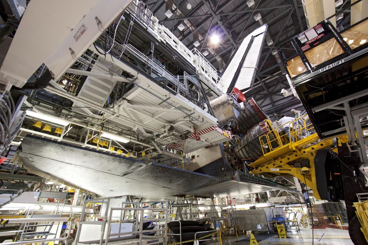 CAPE CANAVERAL, Fla. -- In Orbiter Processing Facility-1 at NASA's Kennedy Space Center in Florida, technicians carefully remove engine No. 2, one of three space shuttle main engines from Endeavour, using a specially designed engine installer, called a Hyster forklift. The removal is part of Endeavour's transition and retirement processing. Endeavour is being prepared for public display at the California Science Center in Los Angeles. Endeavour flew 25 missions, spent 299 days in space, orbited Earth 4,671 times and traveled 122,883,151 miles over the course of its 19-year career. Photo credit: NASA/Jim Grossmann