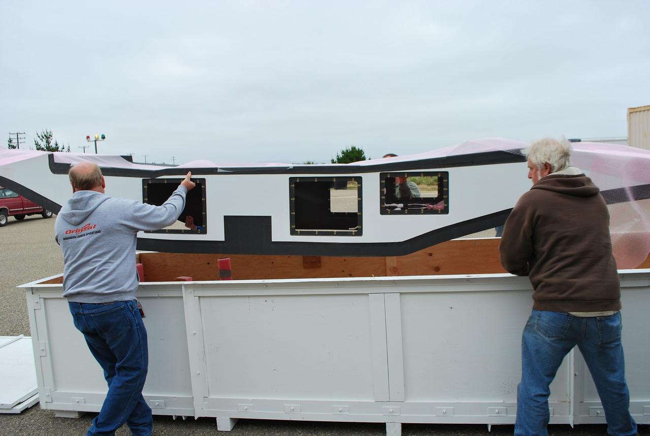 VANDENBERG AIR FORCE BASE, Calif. -- At Vandenberg Air Force Base in California, Orbital Sciences Corp. workers uncrate the fillet (the wings of the Pegasus XL launch vehicle) for inspection. The Pegasus rocket is being processed to launch the Nuclear Spectroscopic Telescope Array (NuSTAR) into space.        After the rocket and spacecraft are processed at Vandenberg, they will be flown on the Orbital Sciences' L-1011 carrier aircraft to the Ronald Reagan Ballistic Missile Defense Test Site located at the Pacific Ocean’s Kwajalein Atoll for launch. The high-energy X-ray telescope will conduct a census for black holes, map radioactive material in young supernovae remnants, and study the origins of cosmic rays and the extreme physics around collapsed stars. Photo credit: NASA/Randy Beaudoin, VAFB