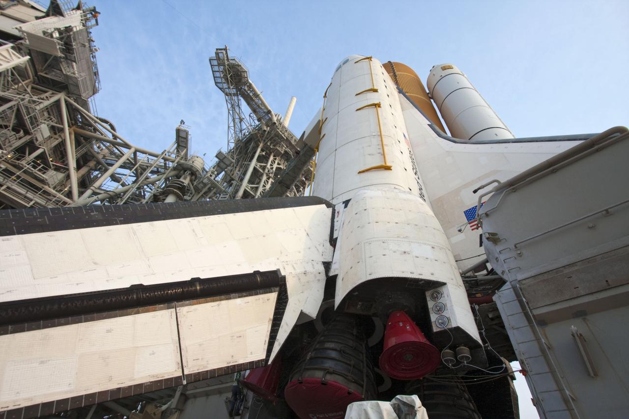 CAPE CANAVERAL, Fla. -- On Launch Pad 39A at NASA's Kennedy Space Center in Florida, the access arm supporting the pad's White Room is in place against space shuttle Atlantis. The room provides workers and astronauts an entry point to the shuttle's crew compartment. The Raffaello multi-purpose logistics module (MPLM) payload for space shuttle Atlantis' STS-135 mission to the International Space Station has been delivered to the pad. The payload canister will be lifted to the payload changeout room and the payload ground-handling mechanism then will be used to transfer Raffaello out of the canister into Atlantis' payload bay. Next, the rotating service structure that protects the shuttle from the elements and provides access will be rotated back into place.          Commander Chris Ferguson, Pilot Doug Hurley and Mission Specialists Sandy Magnus and Rex Walheim are targeted to lift off on space shuttle Atlantis July 8, taking with them the MPLM packed with supplies, logistics and spare parts to the International Space Station. The STS-135 mission also will fly a system to investigate the potential for robotically refueling existing satellites and return a failed ammonia pump module to help NASA better understand the failure mechanism and improve pump designs for future systems. STS-135 will be the 33rd flight of Atlantis, the 37th shuttle mission to the space station, and the 135th and final mission of NASA's Space Shuttle Program. For more information visit, www.nasa.gov/mission_pages/shuttle/shuttlemissions/sts135/index.html. Photo credit: NASA/Ken Thornsley