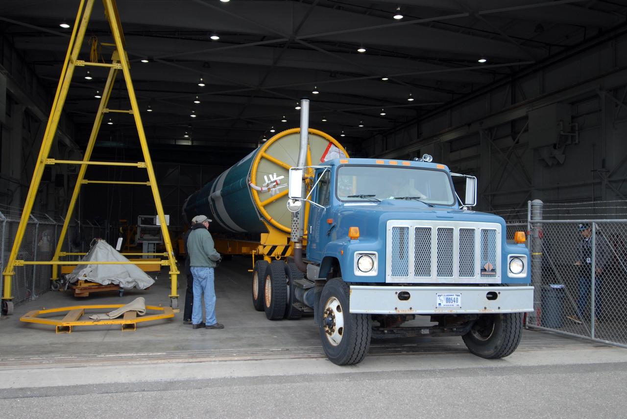 VANDENBERG AIR FORCE BASE, Calif. -- At Vandenberg Air Force Base in California, the first stage of a United Launch Alliance Delta II that will carry the National Polar-orbiting Operational Environmental Satellite System Preparatory Project (NPP) satellite into space is on its way from NASA Hangar 836 to NASA's Launch Complex-2. The vehicle then will undergo initial testing at the United Launch Alliance Delta Mission Checkout Facility.     NPP will be positioned 512 miles above the Earth's surface and will orbit about 16 times each day to observe nearly the entire globe. The NPP mission for NASA and the National Oceanic and Atmospheric Administration (NOAA) is to measure Earth's atmospheric and sea surface temperatures, humidity sounding, land and ocean biological activity, and cloud and aerosol properties. For more information, visit www.nasa.gov/NPP. Photo credit: NASA/VAFB