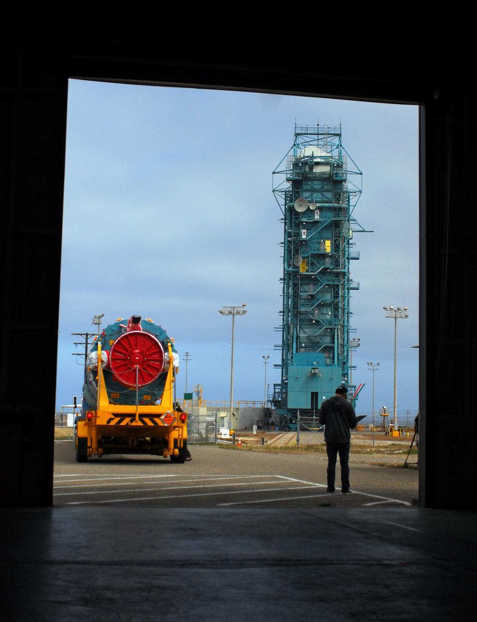 VANDENBERG AIR FORCE BASE, Calif. -- At Vandenberg Air Force Base in California, the first stage of a United Launch Alliance Delta II that will carry the National Polar-orbiting Operational Environmental Satellite System Preparatory Project (NPP) satellite into space has arrived at NASA's Launch Complex-2. The vehicle will undergo initial testing at the United Launch Alliance Delta Mission Checkout Facility.       NPP will be positioned 512 miles above the Earth's surface and will orbit about 16 times each day to observe nearly the entire globe. The NPP mission for NASA and the National Oceanic and Atmospheric Administration (NOAA) is to measure Earth's atmospheric and sea surface temperatures, humidity sounding, land and ocean biological activity, and cloud and aerosol properties. For more information, visit www.nasa.gov/NPP. Photo credit: NASA/VAFB