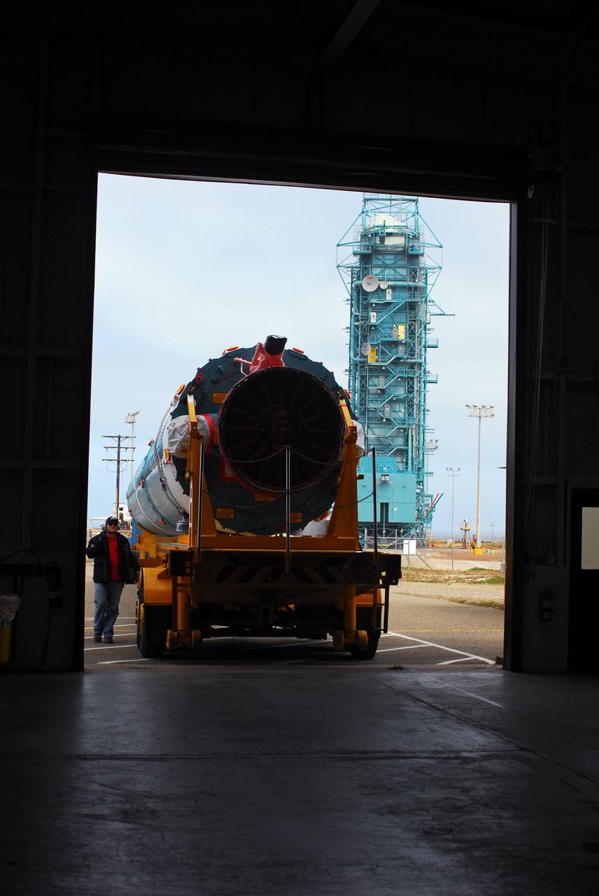 VANDENBERG AIR FORCE BASE, Calif. -- At Vandenberg Air Force Base in California, the first stage of a United Launch Alliance Delta II that will carry the National Polar-orbiting Operational Environmental Satellite System Preparatory Project (NPP) satellite into space has arrived at NASA's Launch Complex-2. The vehicle will undergo initial testing at the United Launch Alliance Delta Mission Checkout Facility.       NPP will be positioned 512 miles above the Earth's surface and will orbit about 16 times each day to observe nearly the entire globe. The NPP mission for NASA and the National Oceanic and Atmospheric Administration (NOAA) is to measure Earth's atmospheric and sea surface temperatures, humidity sounding, land and ocean biological activity, and cloud and aerosol properties. For more information, visit www.nasa.gov/NPP. Photo credit: NASA/VAFB