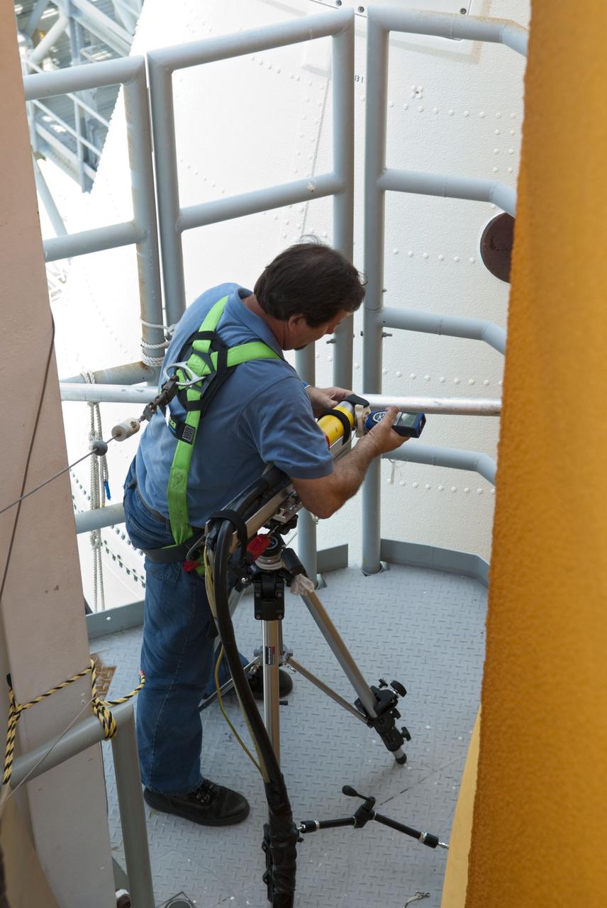 CAPE CANAVERAL, Fla. -- At NASA's Kennedy Space Center in Florida, technicians conduct Computed Radiography (CR) X-ray scans of 50 support beams, called stringers, on the shuttle-facing side of Atlantis' external tank at Launch Pad 39A. The hi-tech images will be taken of the tops and bottoms of the 21-foot long beams, which are located on the tank's intertank section. The scans follow a June 15th tanking test when the launch team filled then drained the tank of about 535,000 gallons of liquid hydrogen and liquid oxygen, just like for a launch. Earlier this year, managers directed teams to make the same stringer modifications to Atlantis' tank, ET-138, as they had after small cracks in the support beams of shuttle Discovery's STS-133 mission external tank were discovered. The scans will confirm there are no issues with Atlantis' tank.                    STS-135 Commander Chris Ferguson, Pilot Doug Hurley and Mission Specialists Sandy Magnus and Rex Walheim are targeted to lift off on space shuttle Atlantis July 8, taking with them the MPLM packed with supplies, logistics and spare parts to the International Space Station. The STS-135 mission also will fly a system to investigate the potential for robotically refueling existing satellites and return a failed ammonia pump module to help NASA better understand the failure mechanism and improve pump designs for future systems. STS-135 will be the 33rd flight of Atlantis, the 37th shuttle mission to the space station, and the 135th and final mission of NASA's Space Shuttle Program. For more information visit, www.nasa.gov/mission_pages/shuttle/shuttlemissions/sts135/index.html. Photo credit: NASA/Jim Grossmann
