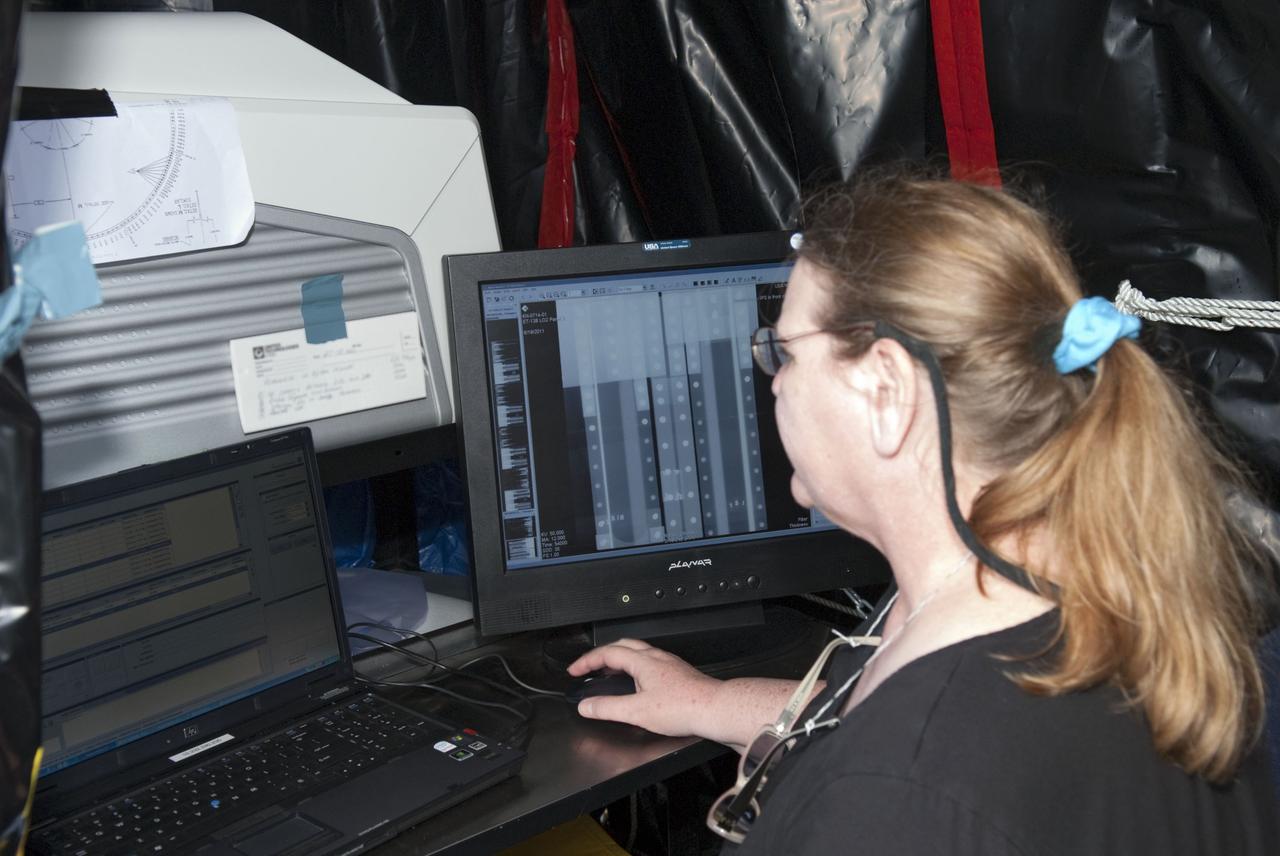 CAPE CANAVERAL, Fla. -- At NASA's Kennedy Space Center in Florida, technicians conduct Computed Radiography (CR) X-ray scans of 50 support beams, called stringers, on the shuttle-facing side of Atlantis' external tank at Launch Pad 39A. The hi-tech images will be taken of the tops and bottoms of the 21-foot long beams, which are located on the tank's intertank section. The scans follow a June 15th tanking test when the launch team filled then drained the tank of about 535,000 gallons of liquid hydrogen and liquid oxygen, just like for a launch. Earlier this year, managers directed teams to make the same stringer modifications to Atlantis' tank, ET-138, as they had after small cracks in the support beams of shuttle Discovery's STS-133 mission external tank were discovered. The scans will confirm there are no issues with Atlantis' tank.                    STS-135 Commander Chris Ferguson, Pilot Doug Hurley and Mission Specialists Sandy Magnus and Rex Walheim are targeted to lift off on space shuttle Atlantis July 8, taking with them the MPLM packed with supplies, logistics and spare parts to the International Space Station. The STS-135 mission also will fly a system to investigate the potential for robotically refueling existing satellites and return a failed ammonia pump module to help NASA better understand the failure mechanism and improve pump designs for future systems. STS-135 will be the 33rd flight of Atlantis, the 37th shuttle mission to the space station, and the 135th and final mission of NASA's Space Shuttle Program. For more information visit, www.nasa.gov/mission_pages/shuttle/shuttlemissions/sts135/index.html. Photo credit: NASA/Jim Grossmann