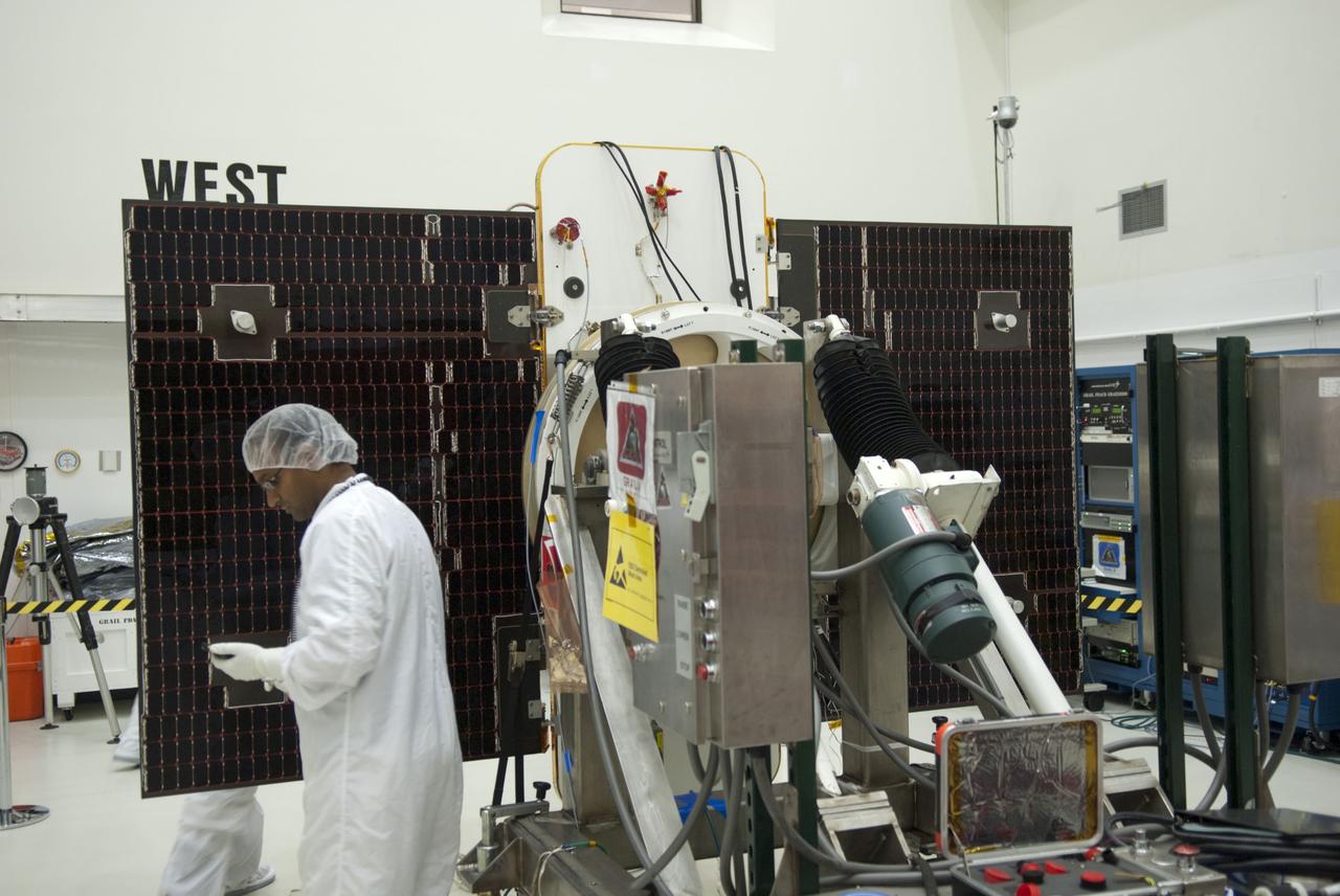 CAPE CANAVERAL, Fla. -- Technicians at Astrotech payload processing facility in Titusville, Fla., are conducting solar panel deployment tests on NASA's Gravity Recovery and Interior Laboratory, or GRAIL, twin spacecraft. The United Launch Alliance Delta II rocket that will carry GRAIL into lunar orbit already is fully stacked at NASA's Space Launch Complex 17B, and launch is scheduled for Sept. 8. The GRAIL mission is a part of NASA's Discovery Program. GRAIL will fly the twin spacecraft in tandem orbits around the moon for several months to measure its gravity field. The mission also will answer longstanding questions about Earth's moon and provide scientists a better understanding of how Earth and other rocky planets in the solar system formed. For more information, visit http://solarsystem.nasa.gov/grail/. Photo credit: NASA/Jim Grossmann