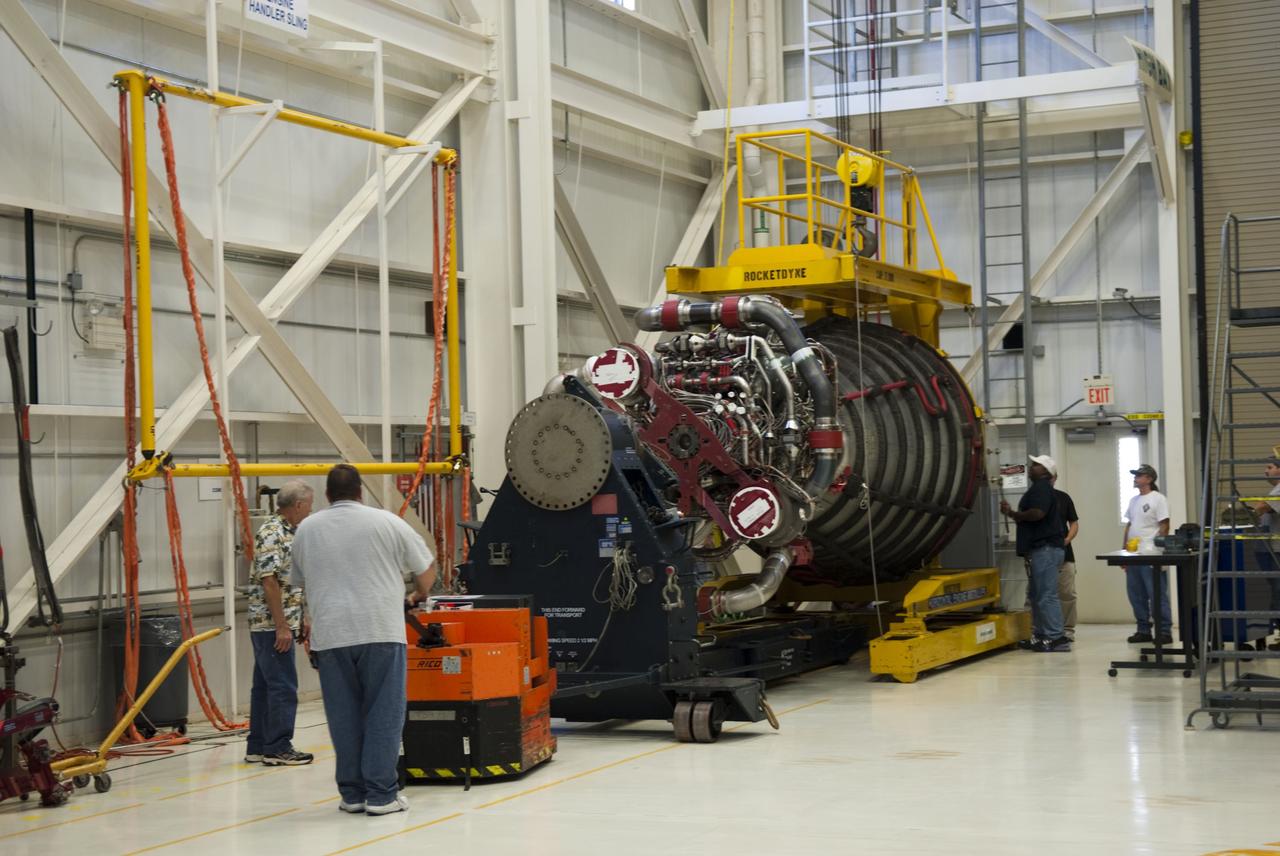 CAPE CANAVERAL, Fla. -- In the engine shop at NASA's Kennedy Space Center in Florida, workers are moving engine No. 3, one of three space shuttle main engines from Endeavour, to a work stand for processing. The work is part of Endeavour's transition and retirement processing. Endeavour is being prepared for public display at the California Science Center in Los Angeles. Endeavour flew 25 missions, spent 299 days in space, orbited Earth 4,671 times and traveled 122,883,151 miles over the course of its 19-year career. Endeavour's STS-134 and final mission was completed after landing on June 1, 2011. Photo credit: NASA/Jim Grossmann