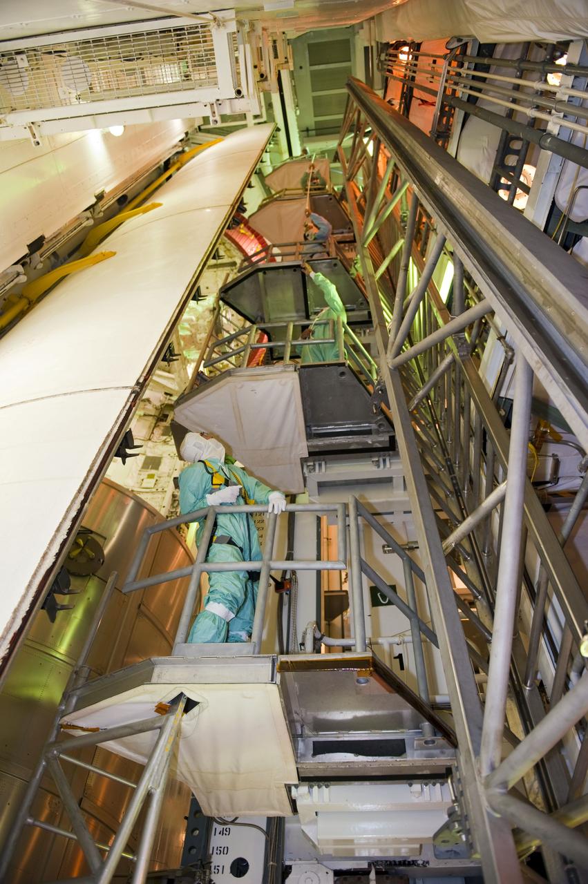 CAPE CANAVERAL, Fla. -- At NASA's Kennedy Space Center in Florida, technicians in the payload changeout room have maneuvered space shuttle Atlantis' cargo, the Raffaello multi-purpose logistics module (MPLM) into the shuttle's payload bay using the payload ground-handling mechanism at Launch Pad 39A. The rotating service structure that protects the shuttle from the elements and provides access has been moved back into place.              STS-135 Commander Chris Ferguson, Pilot Doug Hurley and Mission Specialists Sandy Magnus and Rex Walheim are targeted to lift off on Atlantis July 8, taking with them the MPLM packed with supplies, logistics and spare parts to the station. The STS-135 mission also will fly a system to investigate the potential for robotically refueling existing satellites and return a failed ammonia pump module to help NASA better understand the failure mechanism and improve pump designs for future systems. STS-135 will be the 33rd flight of Atlantis, the 37th shuttle mission to the space station, and the 135th and final mission of NASA's Space Shuttle Program. For more information visit, www.nasa.gov/mission_pages/shuttle/shuttlemissions/sts135/index.html. Photo credit: NASA/Kim Shiflett