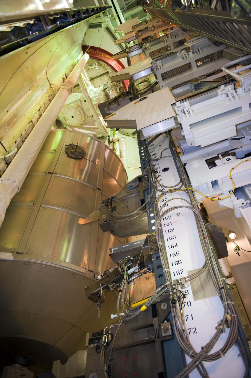CAPE CANAVERAL, Fla. -- At NASA's Kennedy Space Center in Florida, technicians in the payload changeout room have maneuvered space shuttle Atlantis' cargo, the Raffaello multi-purpose logistics module (MPLM) into the shuttle's payload bay using the payload ground-handling mechanism at Launch Pad 39A. The rotating service structure that protects the shuttle from the elements and provides access has been moved back into place.              STS-135 Commander Chris Ferguson, Pilot Doug Hurley and Mission Specialists Sandy Magnus and Rex Walheim are targeted to lift off on Atlantis July 8, taking with them the MPLM packed with supplies, logistics and spare parts to the station. The STS-135 mission also will fly a system to investigate the potential for robotically refueling existing satellites and return a failed ammonia pump module to help NASA better understand the failure mechanism and improve pump designs for future systems. STS-135 will be the 33rd flight of Atlantis, the 37th shuttle mission to the space station, and the 135th and final mission of NASA's Space Shuttle Program. For more information visit, www.nasa.gov/mission_pages/shuttle/shuttlemissions/sts135/index.html. Photo credit: NASA/Kim Shiflett