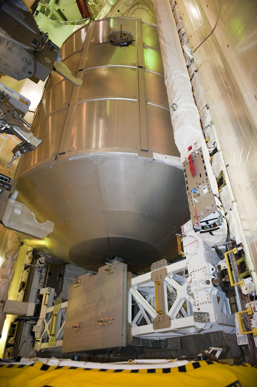 CAPE CANAVERAL, Fla. -- At NASA's Kennedy Space Center in Florida, technicians in the payload changeout room have maneuvered space shuttle Atlantis' cargo, the Raffaello multi-purpose logistics module (MPLM) into the shuttle's payload bay using the payload ground-handling mechanism at Launch Pad 39A. The rotating service structure that protects the shuttle from the elements and provides access has been moved back into place.              STS-135 Commander Chris Ferguson, Pilot Doug Hurley and Mission Specialists Sandy Magnus and Rex Walheim are targeted to lift off on Atlantis July 8, taking with them the MPLM packed with supplies, logistics and spare parts to the station. The STS-135 mission also will fly a system to investigate the potential for robotically refueling existing satellites and return a failed ammonia pump module to help NASA better understand the failure mechanism and improve pump designs for future systems. STS-135 will be the 33rd flight of Atlantis, the 37th shuttle mission to the space station, and the 135th and final mission of NASA's Space Shuttle Program. For more information visit, www.nasa.gov/mission_pages/shuttle/shuttlemissions/sts135/index.html. Photo credit: NASA/Kim Shiflett