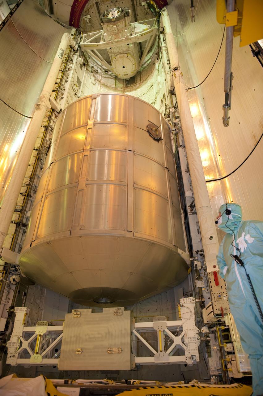 CAPE CANAVERAL, Fla. -- At NASA's Kennedy Space Center in Florida,  technicians in the payload changeout room have maneuvered space shuttle Atlantis' cargo, the Raffaello multi-purpose logistics module (MPLM) into the shuttle's payload bay at Launch Pad 39A. The rotating service structure that protects the shuttle from the elements and provides access has been moved back into place.          STS-135 Commander Chris Ferguson, Pilot Doug Hurley and Mission Specialists Sandy Magnus and Rex Walheim are targeted to lift off on Atlantis July 8, taking with them the MPLM packed with supplies, logistics and spare parts to the station. The STS-135 mission also will fly a system to investigate the potential for robotically refueling existing satellites and return a failed ammonia pump module to help NASA better understand the failure mechanism and improve pump designs for future systems. STS-135 will be the 33rd flight of Atlantis, the 37th shuttle mission to the space station, and the 135th and final mission of NASA's Space Shuttle Program. For more information visit, www.nasa.gov/mission_pages/shuttle/shuttlemissions/sts135/index.html. Photo credit: NASA/Kim Shiflett