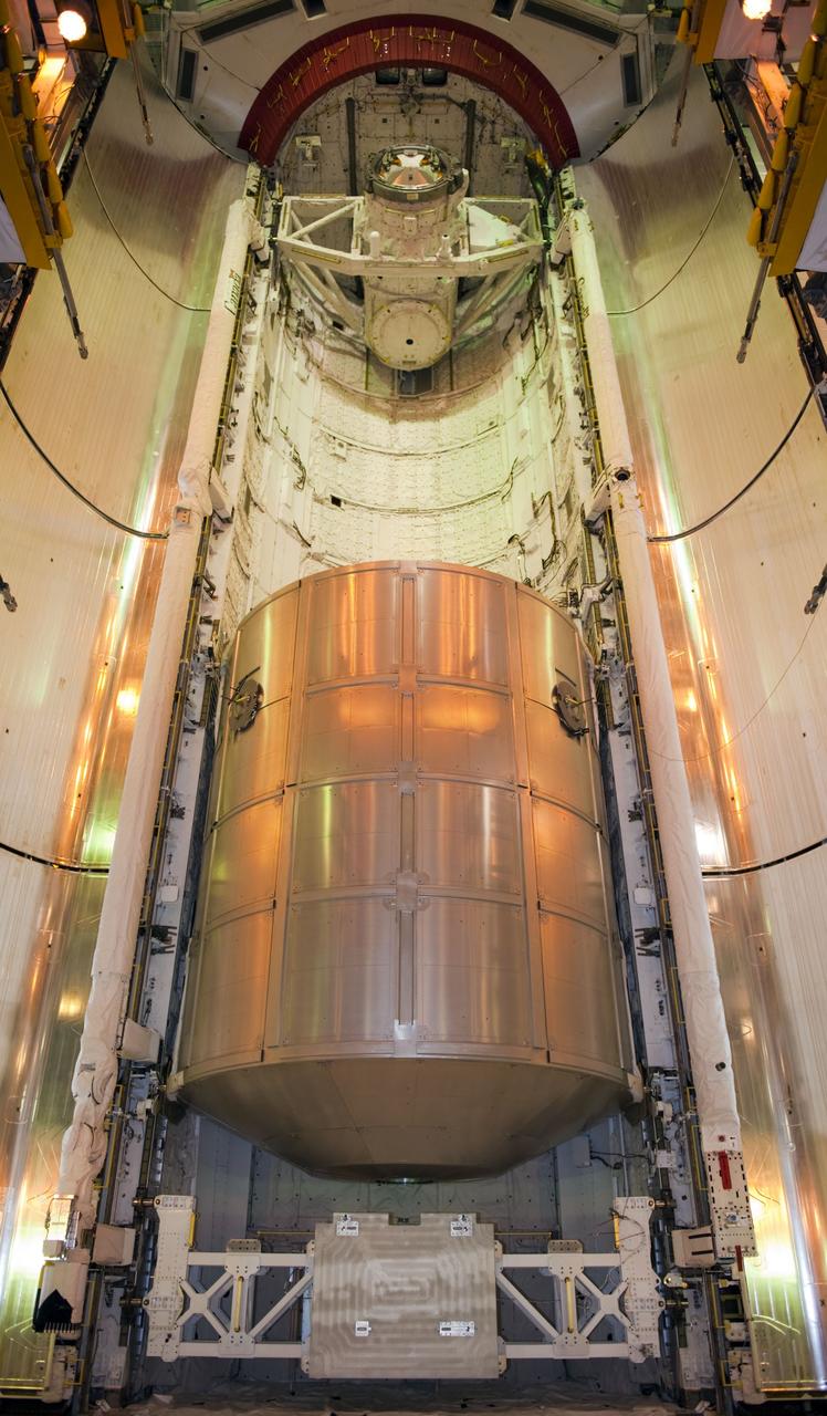 CAPE CANAVERAL, Fla. -- At NASA's Kennedy Space Center in Florida, space shuttle Atlantis' cargo, the Raffaello multi-purpose logistics module (MPLM) now is installed into the shuttle's payload bay at Launch Pad 39A. The rotating service structure that protects the shuttle from the elements and provides access has been moved back into place.        STS-135 Commander Chris Ferguson, Pilot Doug Hurley and Mission Specialists Sandy Magnus and Rex Walheim are targeted to lift off on Atlantis July 8, taking with them the MPLM packed with supplies, logistics and spare parts to the station. The STS-135 mission also will fly a system to investigate the potential for robotically refueling existing satellites and return a failed ammonia pump module to help NASA better understand the failure mechanism and improve pump designs for future systems. STS-135 will be the 33rd flight of Atlantis, the 37th shuttle mission to the space station, and the 135th and final mission of NASA's Space Shuttle Program. For more information visit, www.nasa.gov/mission_pages/shuttle/shuttlemissions/sts135/index.html. Photo credit: NASA/Kim Shiflett