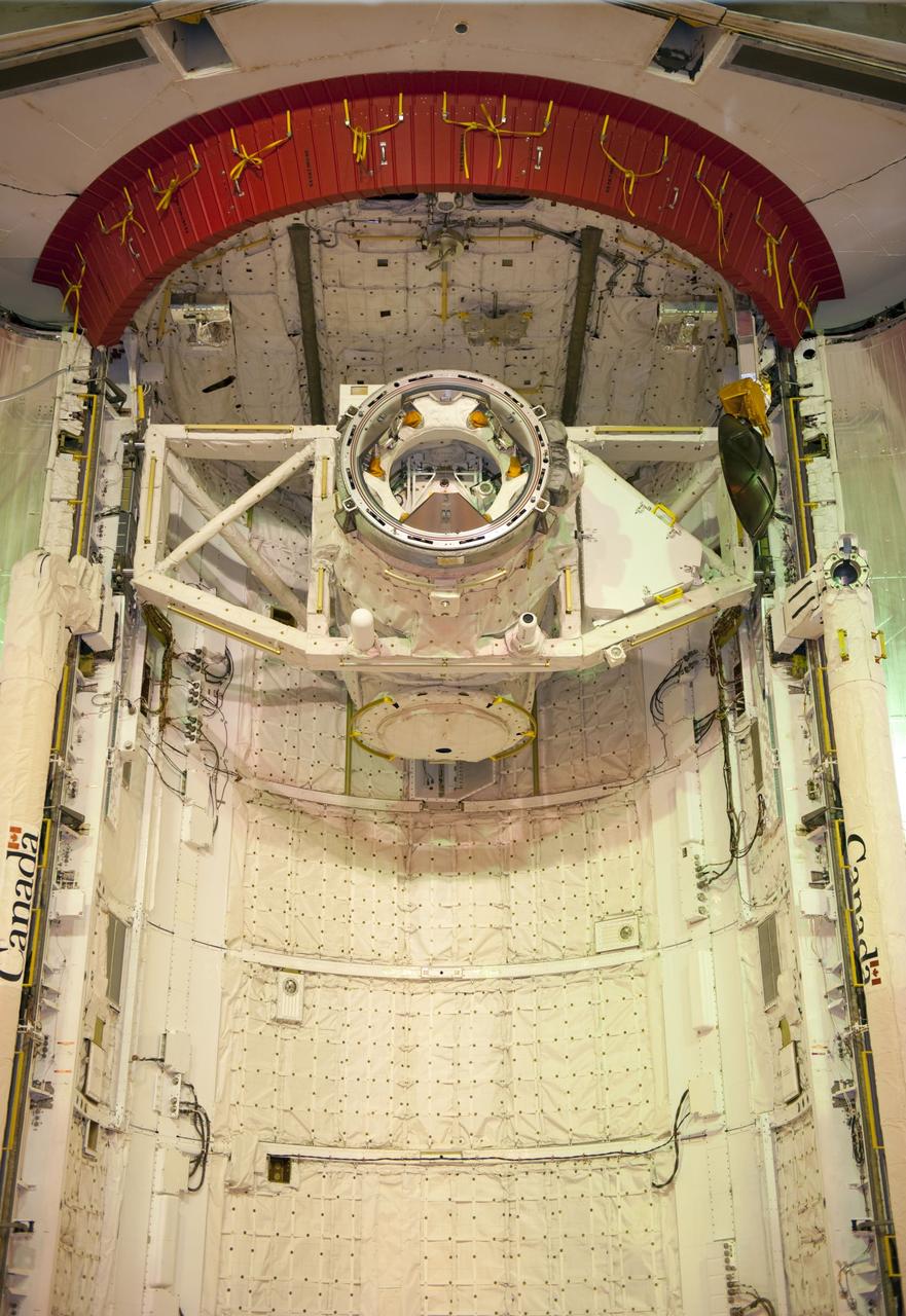 CAPE CANAVERAL, Fla. -- At NASA's Kennedy Space Center in Florida, space shuttle Atlantis' cargo, the Raffaello multi-purpose logistics module (MPLM) now is installed into the shuttle's payload bay at Launch Pad 39A (out of frame). Seen here is the airlock, already installed in the payload bay. The rotating service structure that protects the shuttle from the elements and provides access has been moved back into place.    STS-135 Commander Chris Ferguson, Pilot Doug Hurley and Mission Specialists Sandy Magnus and Rex Walheim are targeted to lift off on Atlantis July 8, taking with them the MPLM packed with supplies, logistics and spare parts to the station. The STS-135 mission also will fly a system to investigate the potential for robotically refueling existing satellites and return a failed ammonia pump module to help NASA better understand the failure mechanism and improve pump designs for future systems. STS-135 will be the 33rd flight of Atlantis, the 37th shuttle mission to the space station, and the 135th and final mission of NASA's Space Shuttle Program. For more information visit, www.nasa.gov/mission_pages/shuttle/shuttlemissions/sts135/index.html. Photo credit: NASA/Kim Shiflett