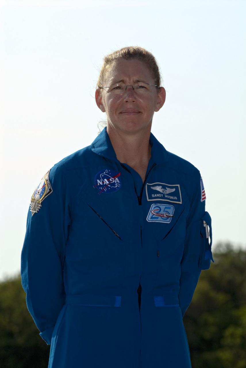 CAPE CANAVERAL, Fla. -- At the Shuttle Landing Facility at NASA's Kennedy Space Center in Florida, STS-135 Mission Specialist Sandy Magnus pauses for a photo. The space shuttle Atlantis crew arrived at Kennedy at about 5:30 p.m. EDT to participate in a launch countdown dress rehearsal called the Terminal Countdown Demonstration Test (TCDT) and related training in preparation for the upcoming STS-135 mission.      Atlantis and its crew is targeted to lift off on July 8, taking with them the Raffaello multi-purpose logistics module packed with supplies and spare parts to the International Space Station. The STS-135 mission also will fly a system to investigate the potential for robotically refueling existing satellites and return a failed ammonia pump module to help NASA better understand the failure mechanism and improve pump designs for future systems. STS-135 will be the 33rd flight of Atlantis, the 37th shuttle mission to the space station, and the 135th and final mission of NASA's Space Shuttle Program. For more information visit, www.nasa.gov/mission_pages/shuttle/shuttlemissions/sts135/index.html. Photo credit: NASA/Kim Shiflett