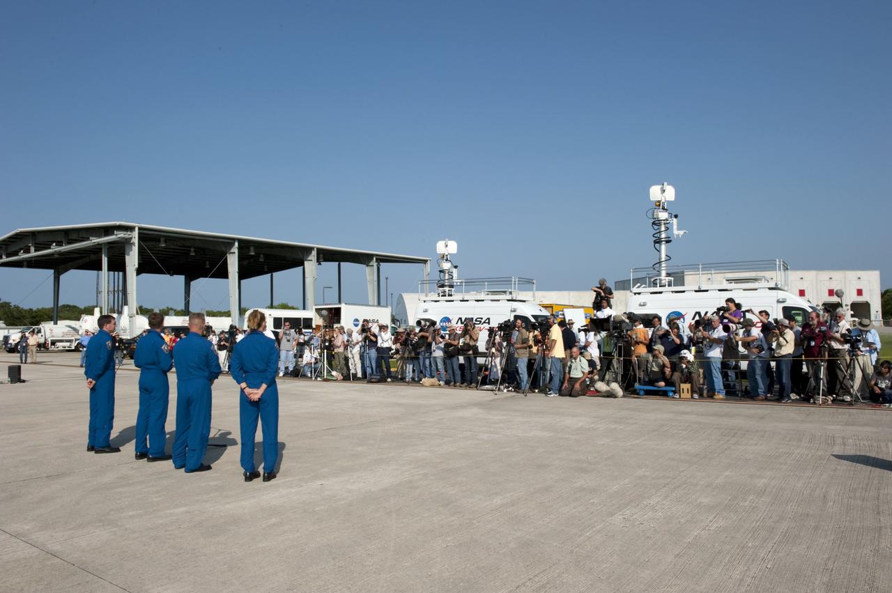 CAPE CANAVERAL, Fla. -- Space shuttle Atlantis' STS-135 crew members address the media on the Shuttle Landing Facility at NASA's Kennedy Space Center in Florida. While at Kennedy, Atlantis' crew will participate in a launch countdown dress rehearsal called the Terminal Countdown Demonstration Test (TCDT) and related training in preparation for the upcoming STS-135 mission.         Atlantis and its crew are targeted to lift off on July 8, taking with them the Raffaello multi-purpose logistics module packed with supplies, logistics and spare parts to the International Space Station. The STS-135 mission also will fly a system to investigate the potential for robotically refueling existing satellites and return a failed ammonia pump module to help NASA better understand the failure mechanism and improve pump designs for future systems. STS-135 will be the 33rd flight of Atlantis, the 37th shuttle mission to the space station, and the 135th and final mission of NASA's Space Shuttle Program. For more information visit, www.nasa.gov/mission_pages/shuttle/shuttlemissions/sts135/index.html. Photo credit: NASA/Kim Shiflett