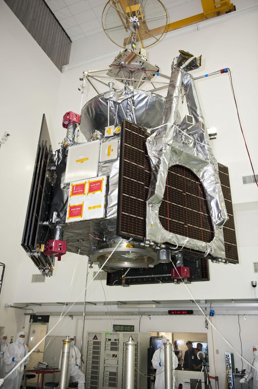 CAPE CANAVERAL, Fla. -- Technicians at Astrotech's payload processing facility in Titusville, Fla. monitor NASA's Juno spacecraft, as it is lifted by an overhead crane, for its move to a rotation stand for center of gravity, weighing and balancing testing.        Juno is scheduled to launch aboard United Launch Alliance Atlas V rocket from Cape Canaveral, Fla. Aug. 5.The solar-powered spacecraft will orbit Jupiter's poles 33 times to find out more about the gas giant's origins, structure, atmosphere and magnetosphere and investigate the existence of a solid planetary core. For more information visit: www.nasa.gov/juno. Photo credit: NASA/Kim Shiflett